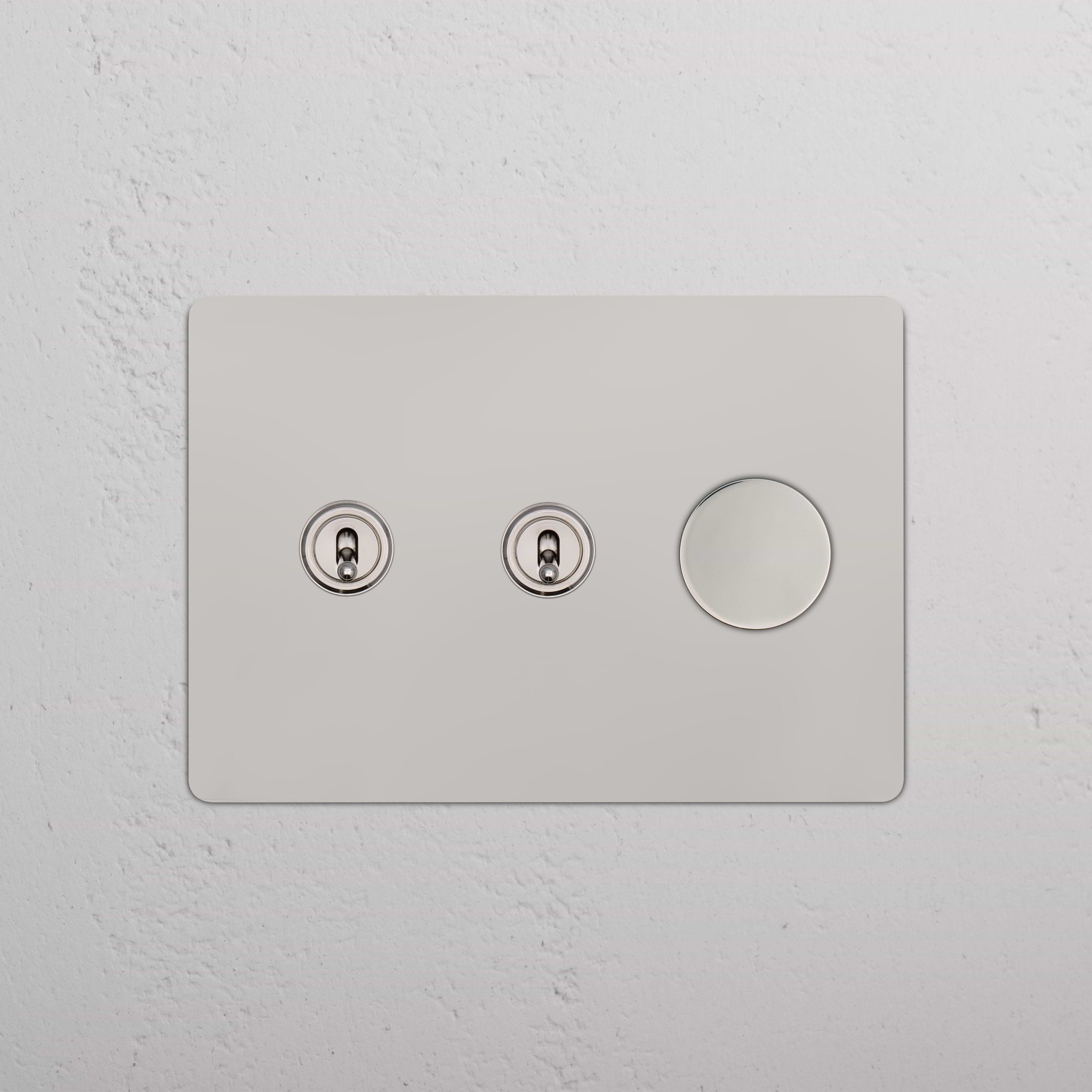 Kew 3G 2x Toggle & Dimmer Switch in polished nickel, a light switch panel with two toggles and one dimmer.