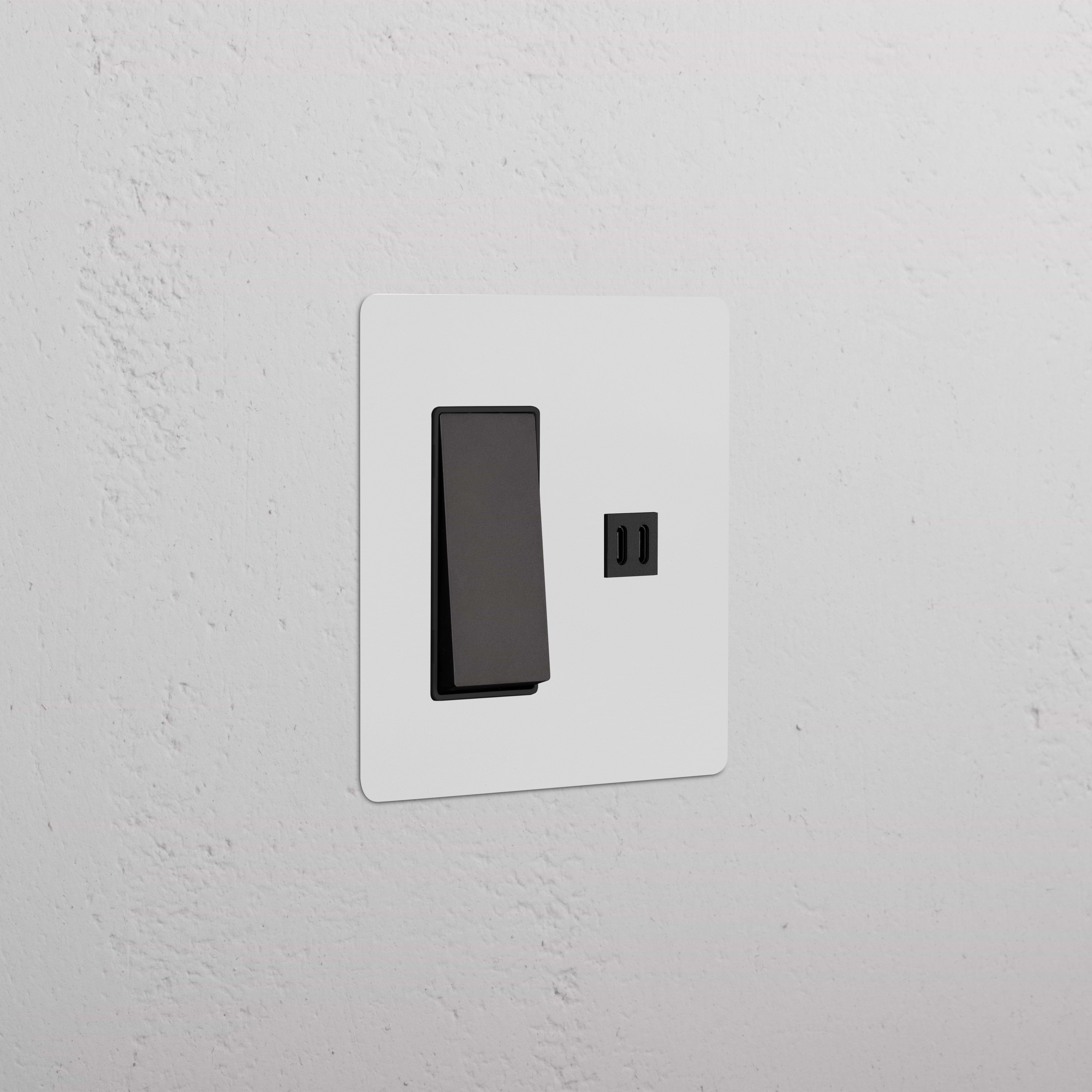 Kew 2G Rocker Switch with Fast Charge USB in Paintable Bronze Black, shown installed on a white wall.