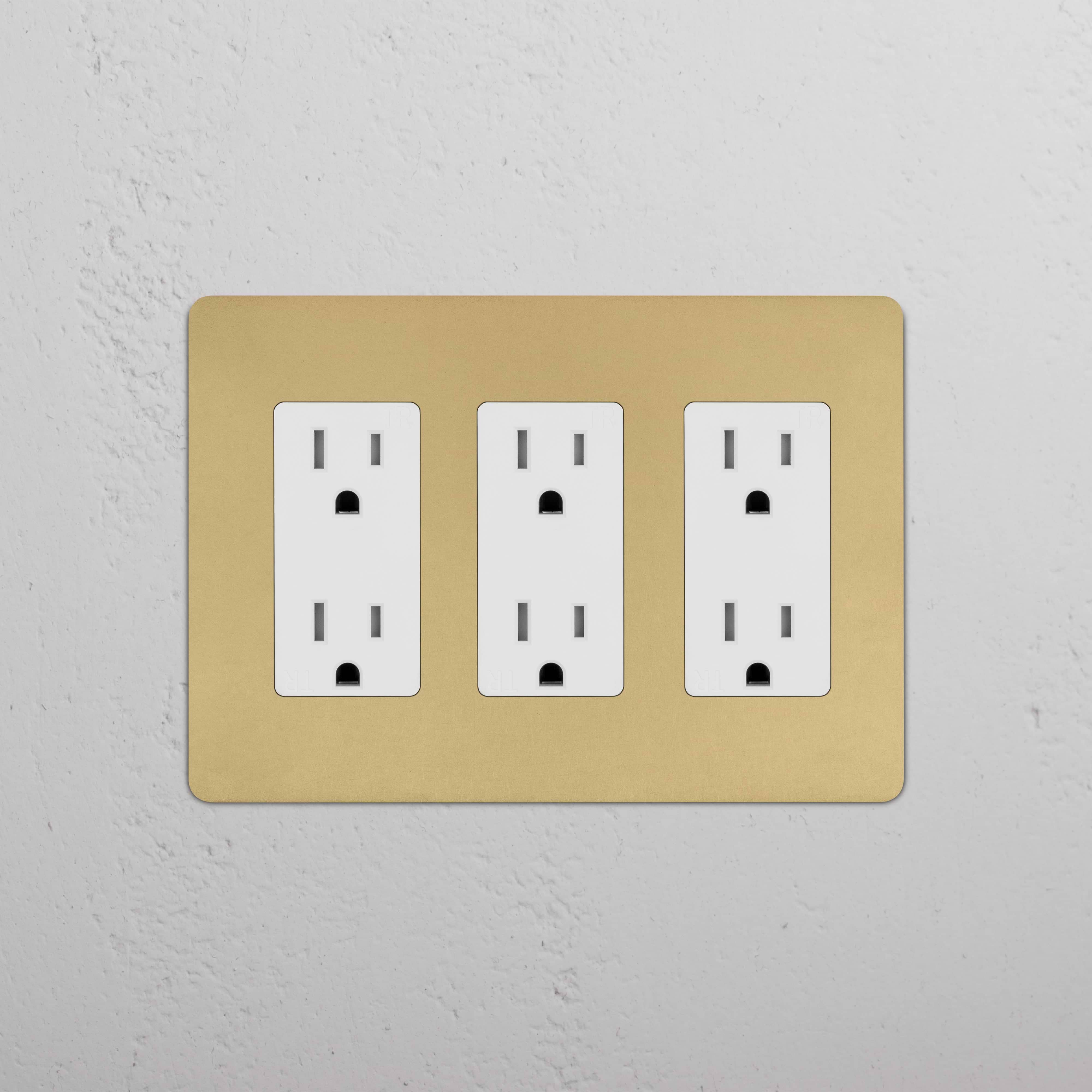 Kew 3G Outlet in Antique Brass White finish with three UK plug sockets, mounted on a white wall.