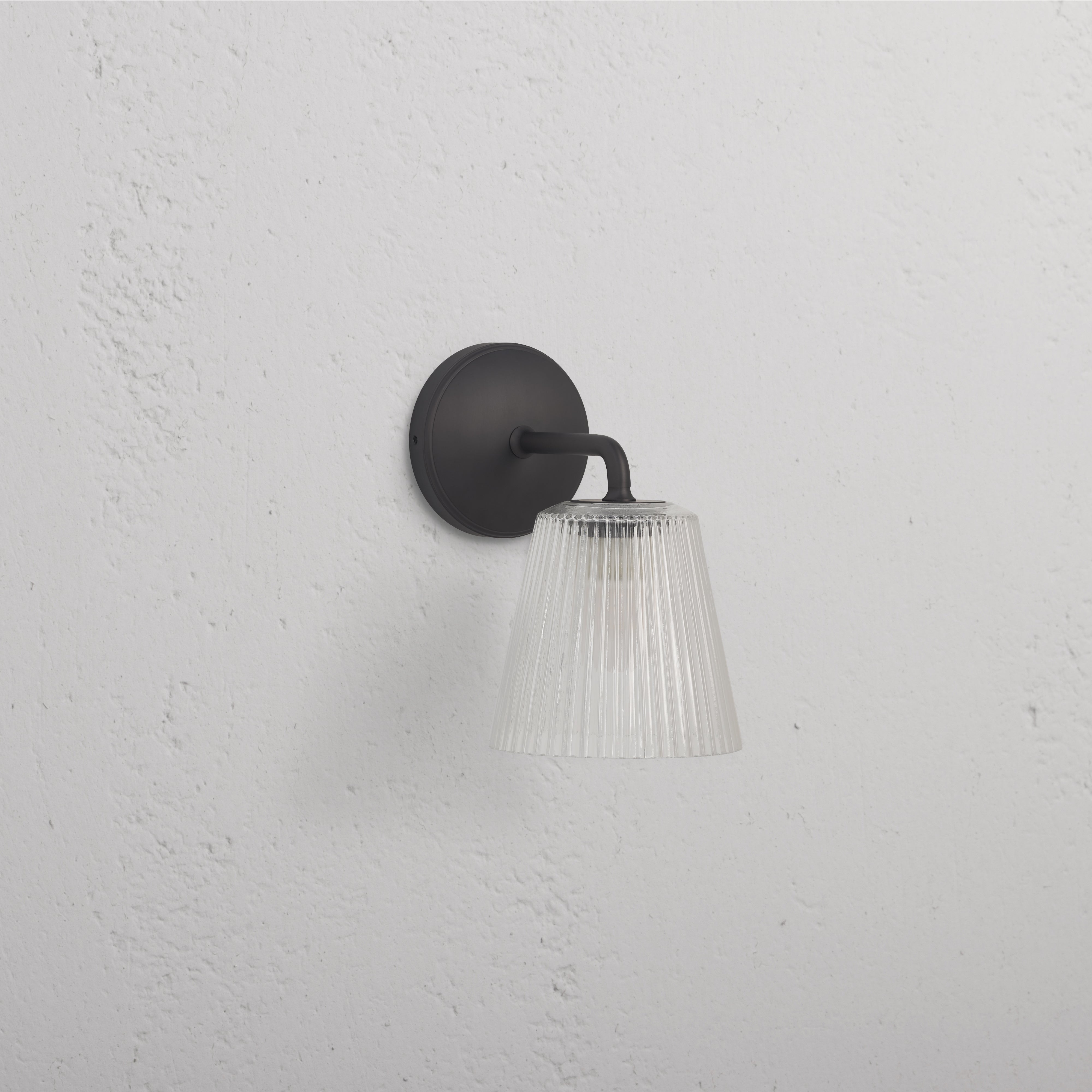 Richmond Medium Wall Light Fluted Glass in bronze with ribbed glass shade and bronze base, wall-mounted.