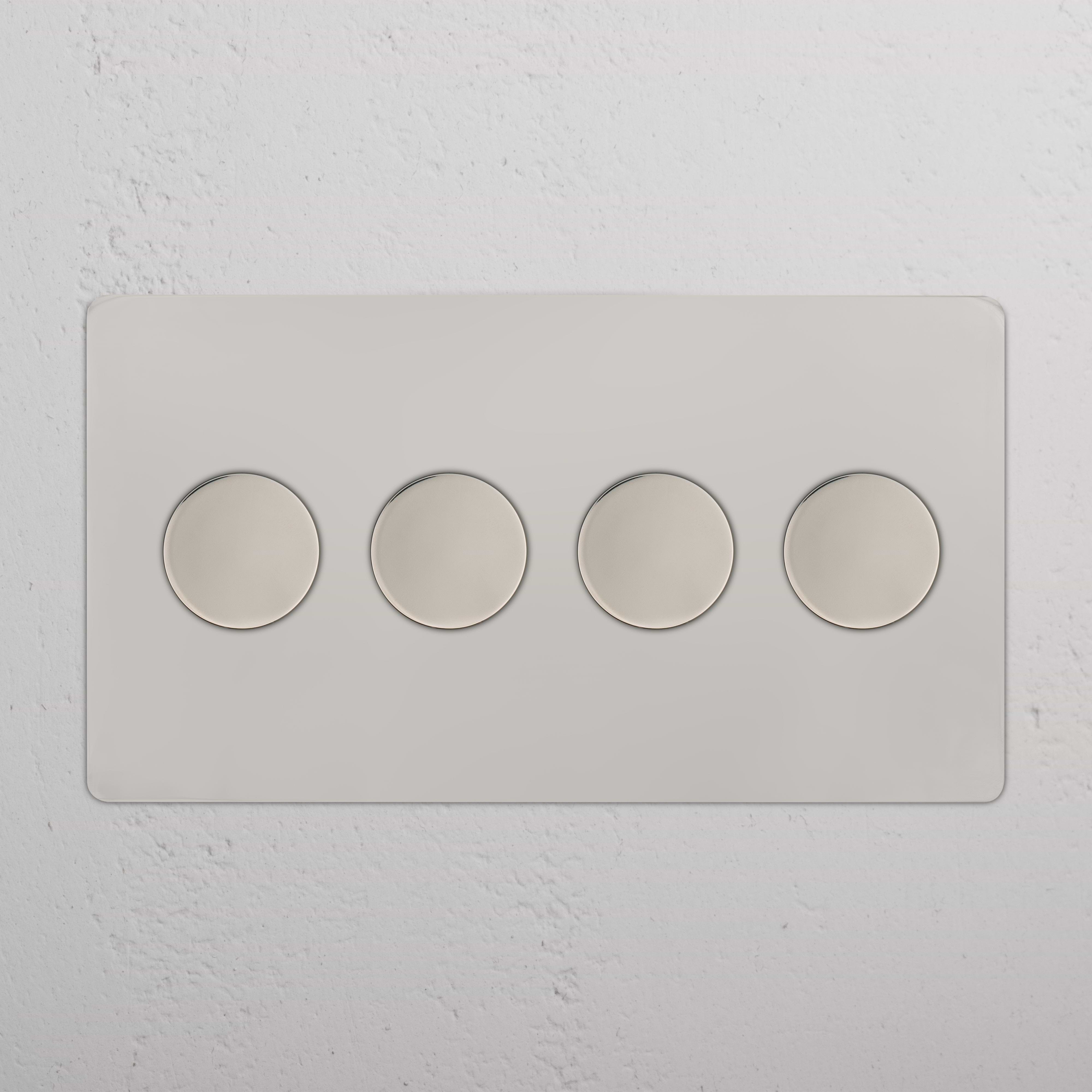 Kew 4G Dimmer Switch in polished nickel with four round control knobs arranged horizontally.