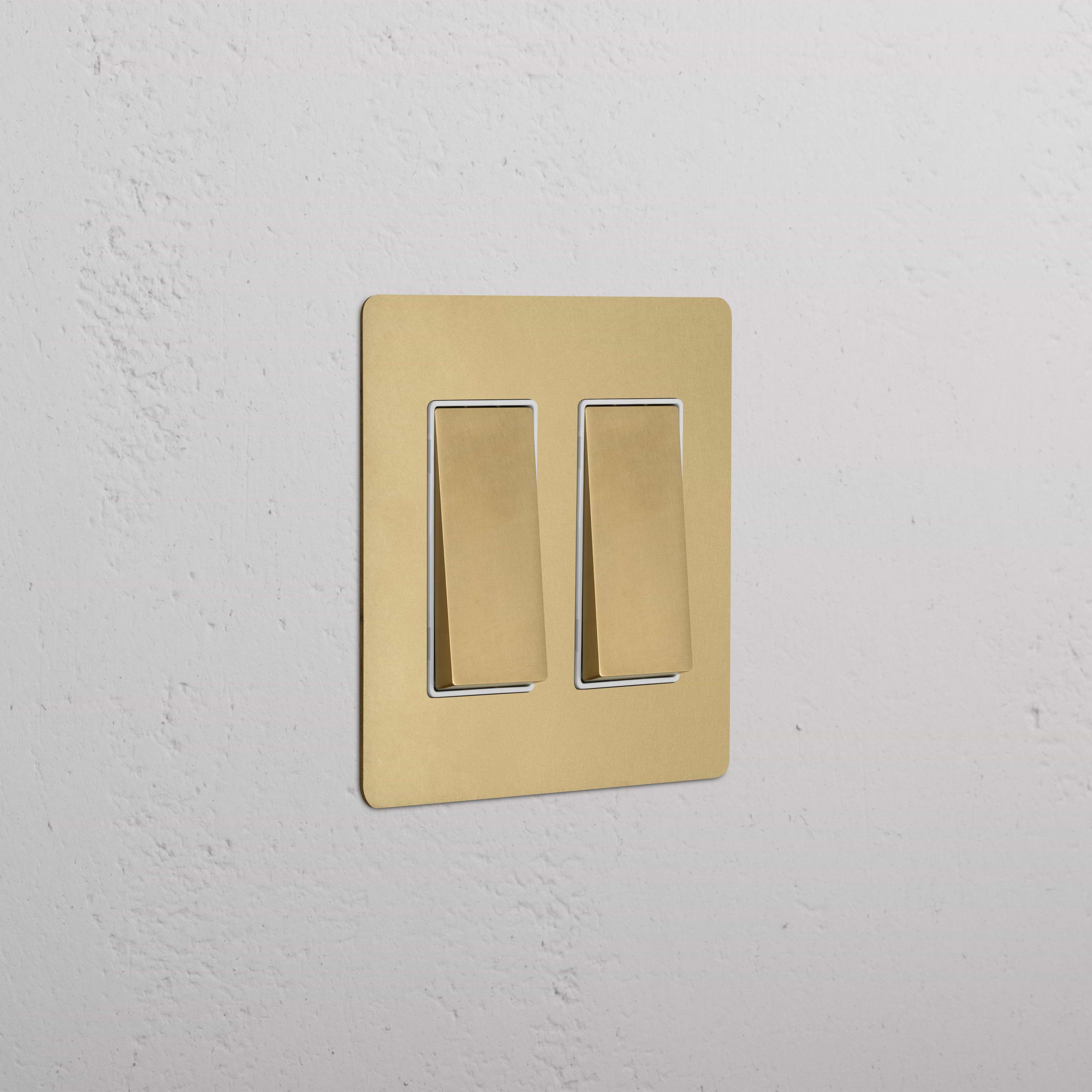 Kew 2G Rocker Switch in antique brass with white inserts, featuring two rocker switches.