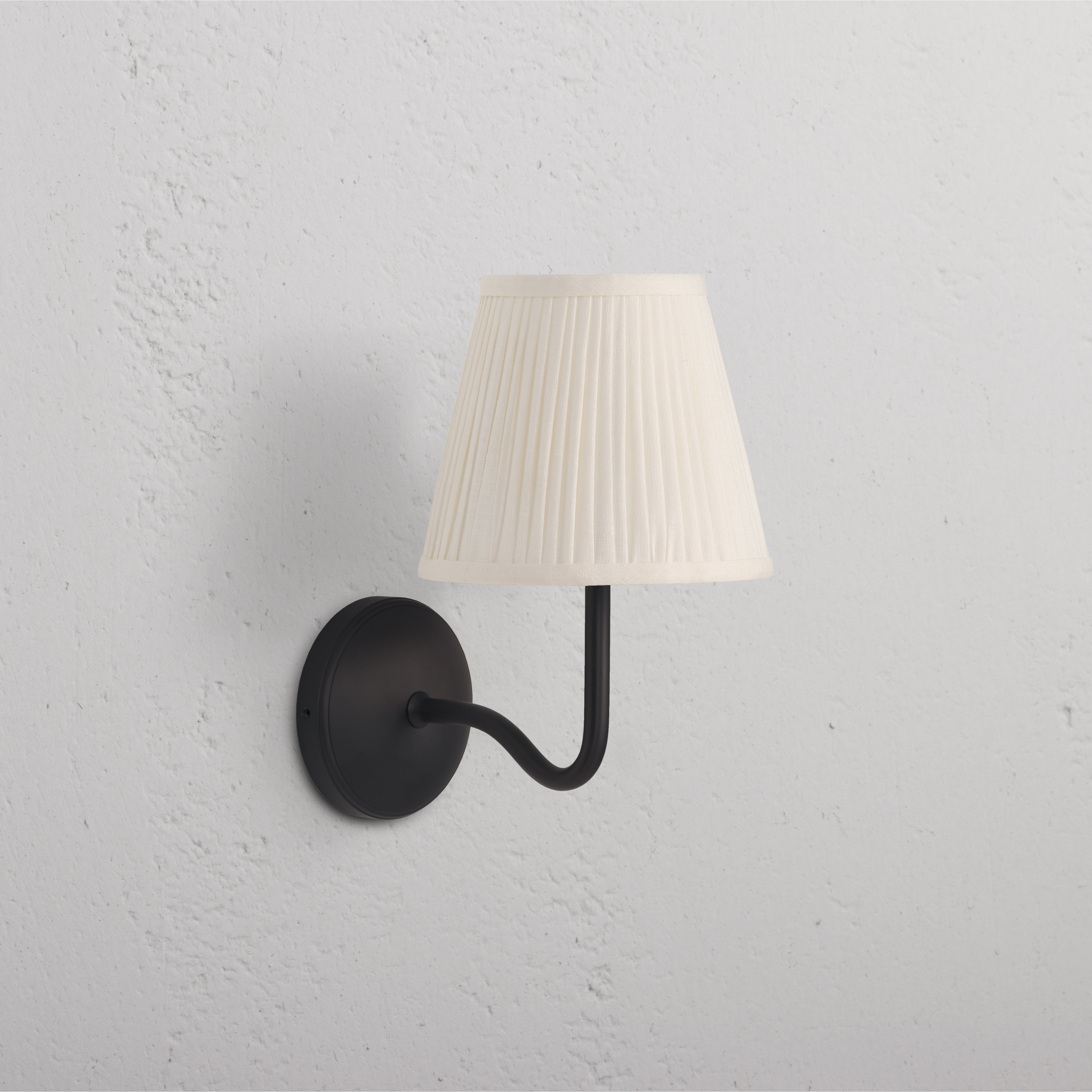 Malvern Medium Wall Light Alabaster White - Bronze with curved bronze arm and pleated alabaster white shade.