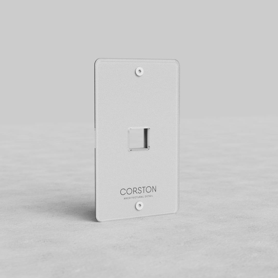 Clear 1G Keystone Plate Kew US with single port, two screw holes, and subtle Corston branding.
