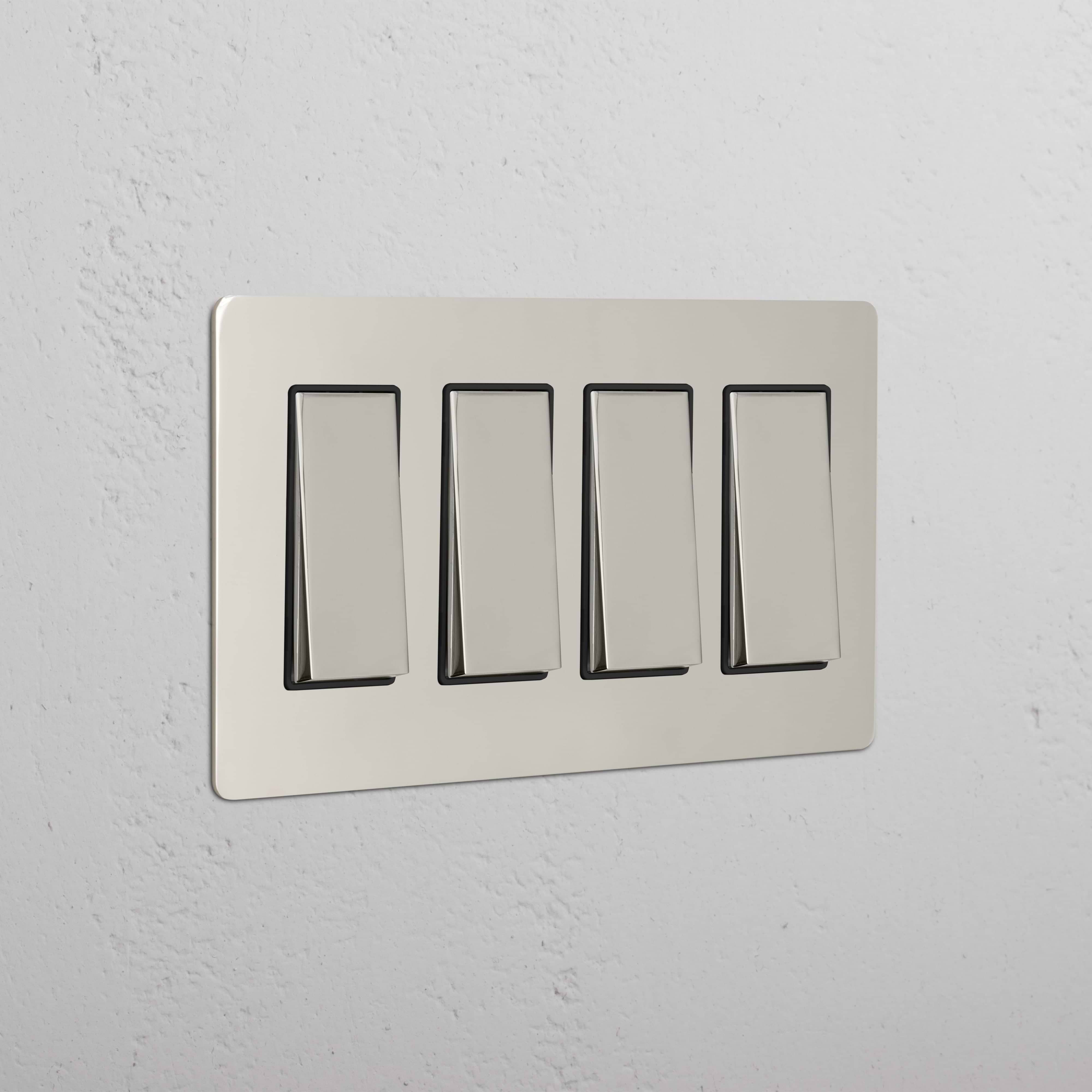 Kew 4G Rocker Switch in polished nickel black finish, four-gang plate, mounted on a wall.