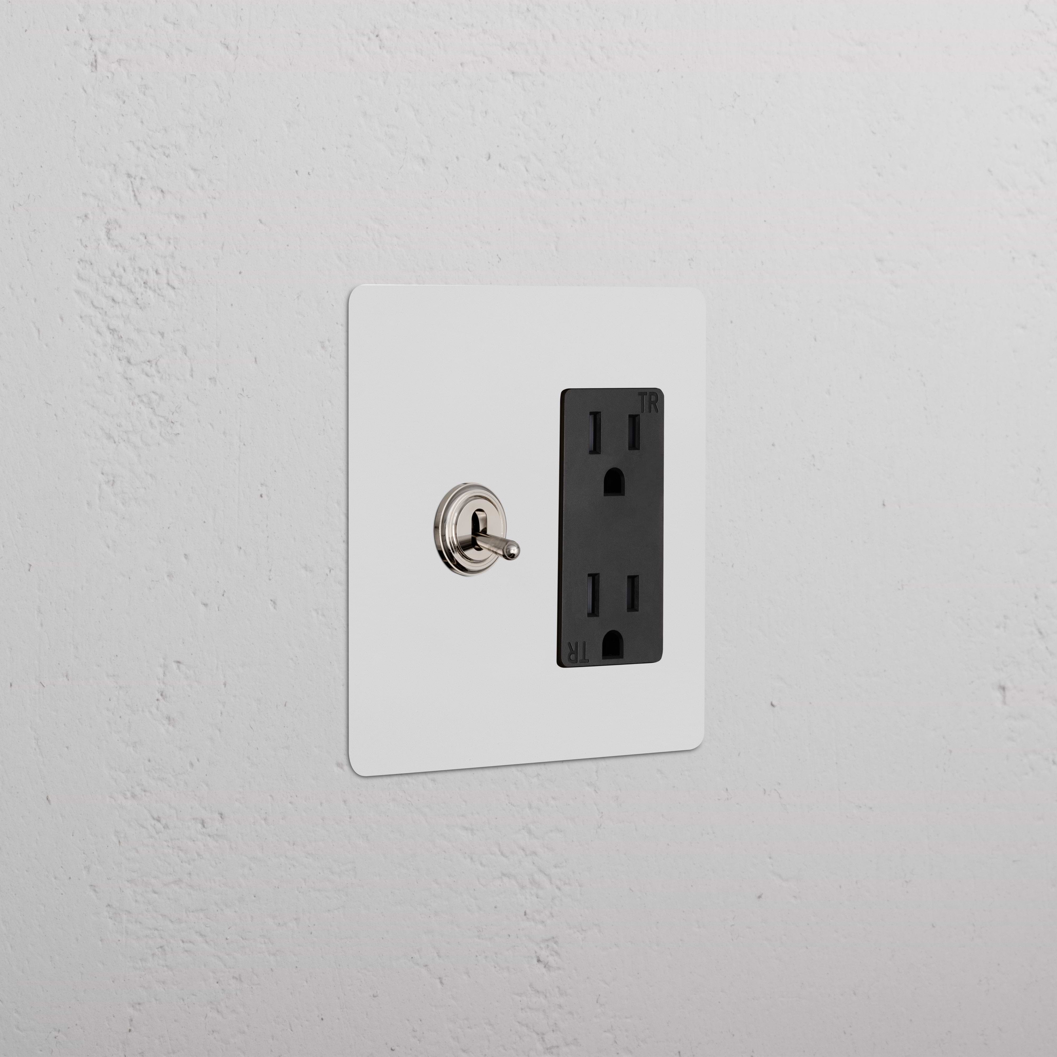 Kew 2G Toggle Switch & Outlet in Paintable Polished Nickel Black with white plate, black outlet, silver toggle.