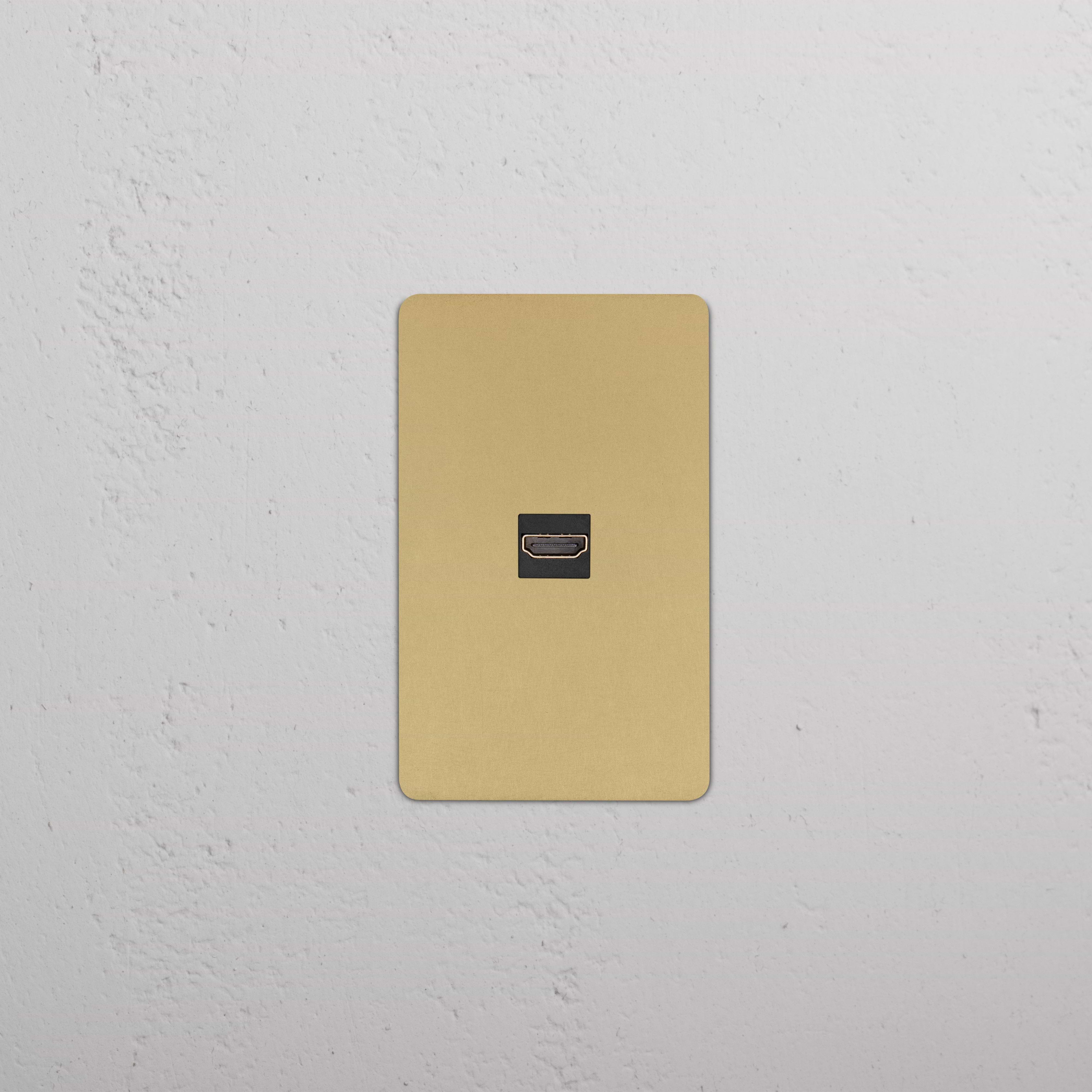 Kew 1G HDMI Keystone wall plate in Antique Brass Black finish with one HDMI port, shown on a white wall.