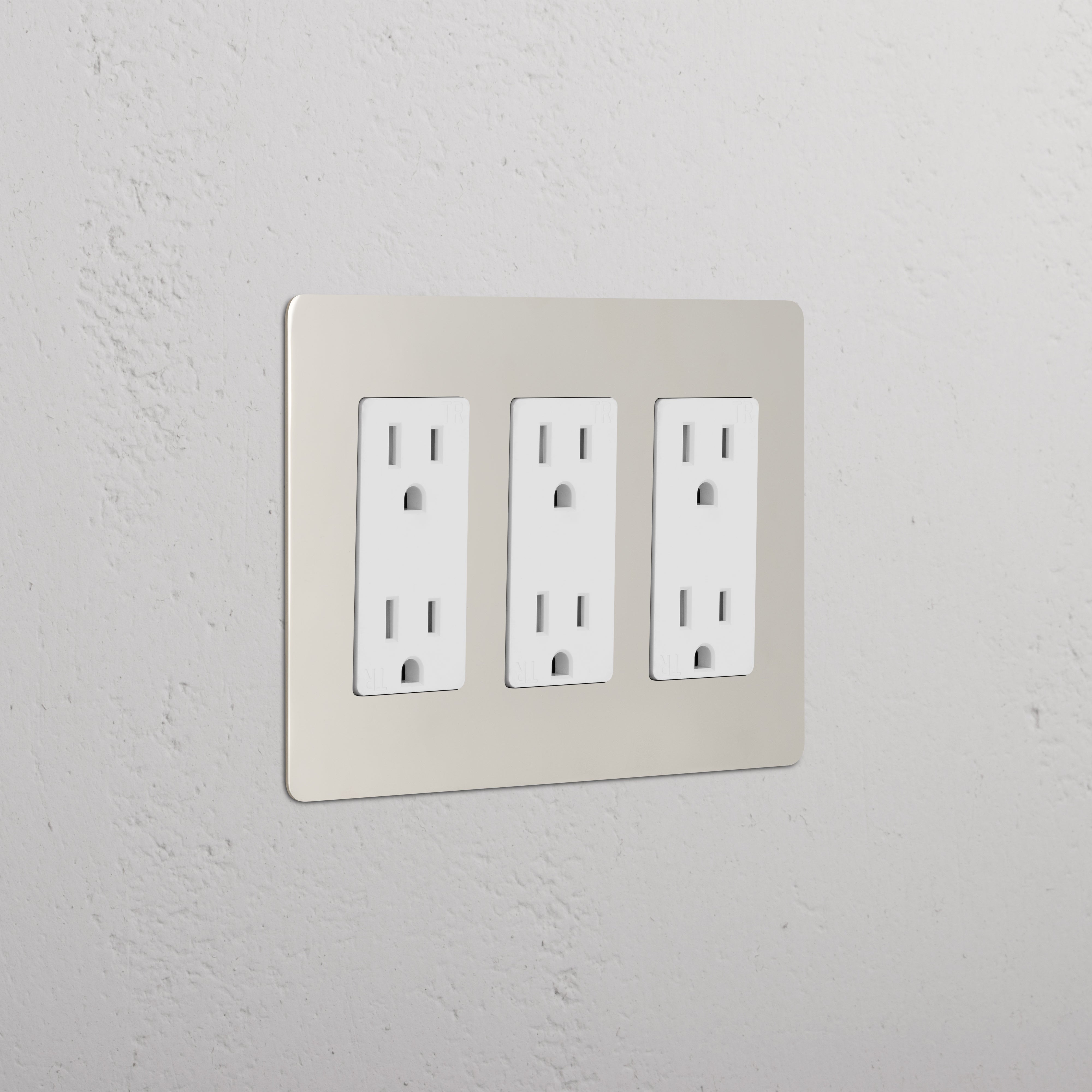 Kew 3G Outlet in polished nickel white finish, triple electrical socket plate on a light wall.