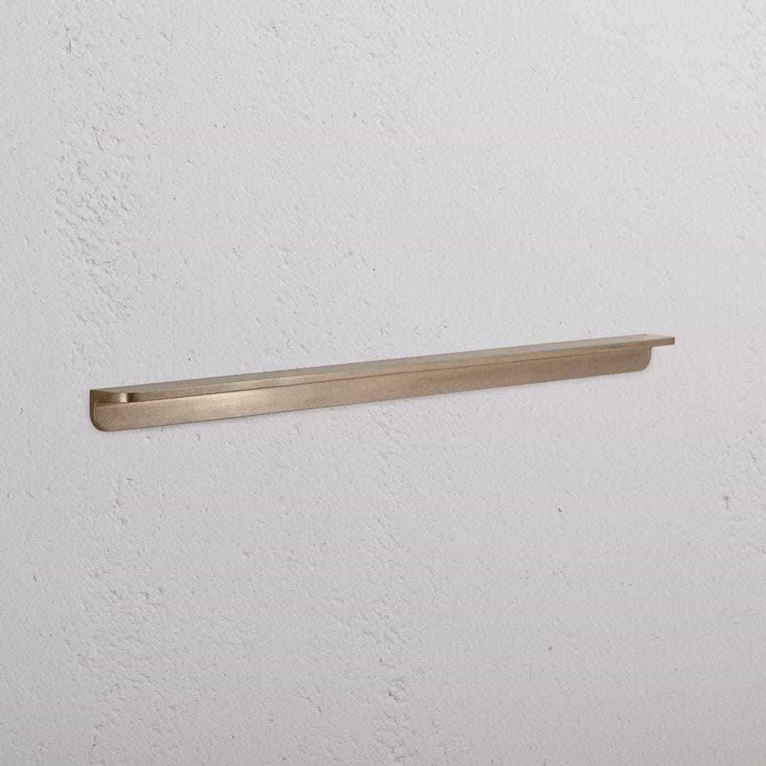 Large antique brass Oxford furniture handle with a classic curved design, shown against a white background.