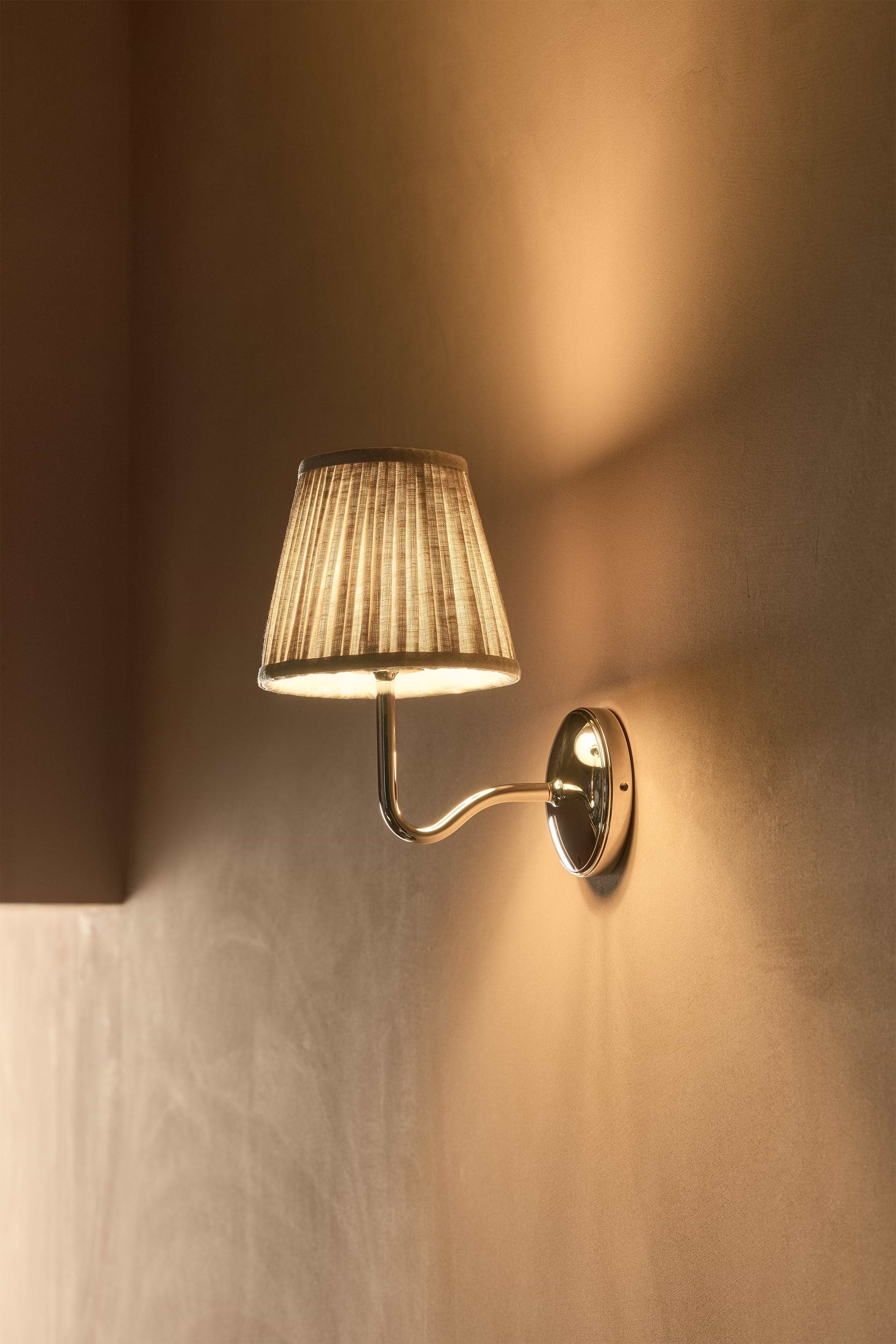 Malvern Medium Wall Light in natural beige with polished nickel base and pleated shade, wall-mounted.