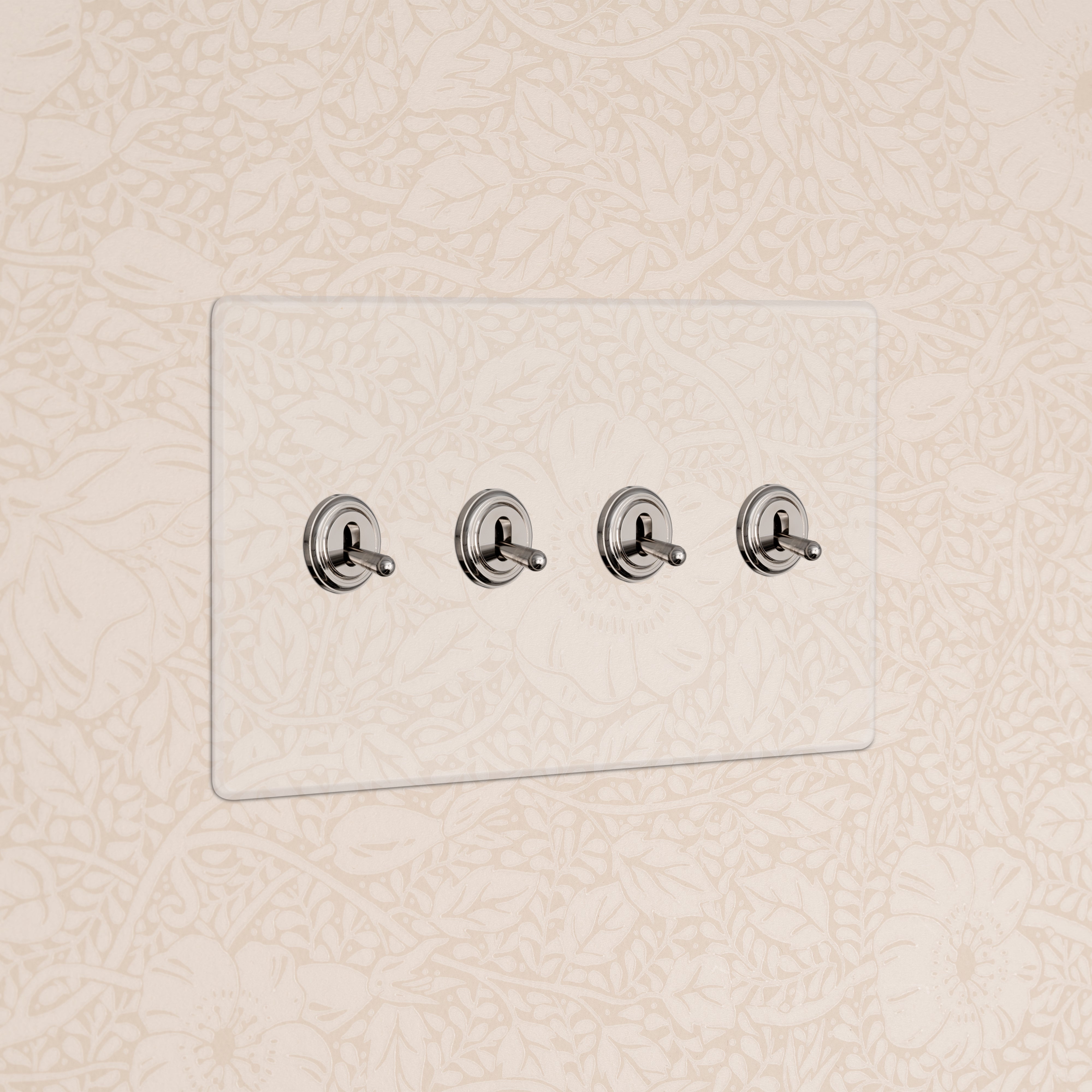 Kew 4G Toggle Switch in clear polished nickel with four switches on a clear rectangular plate.