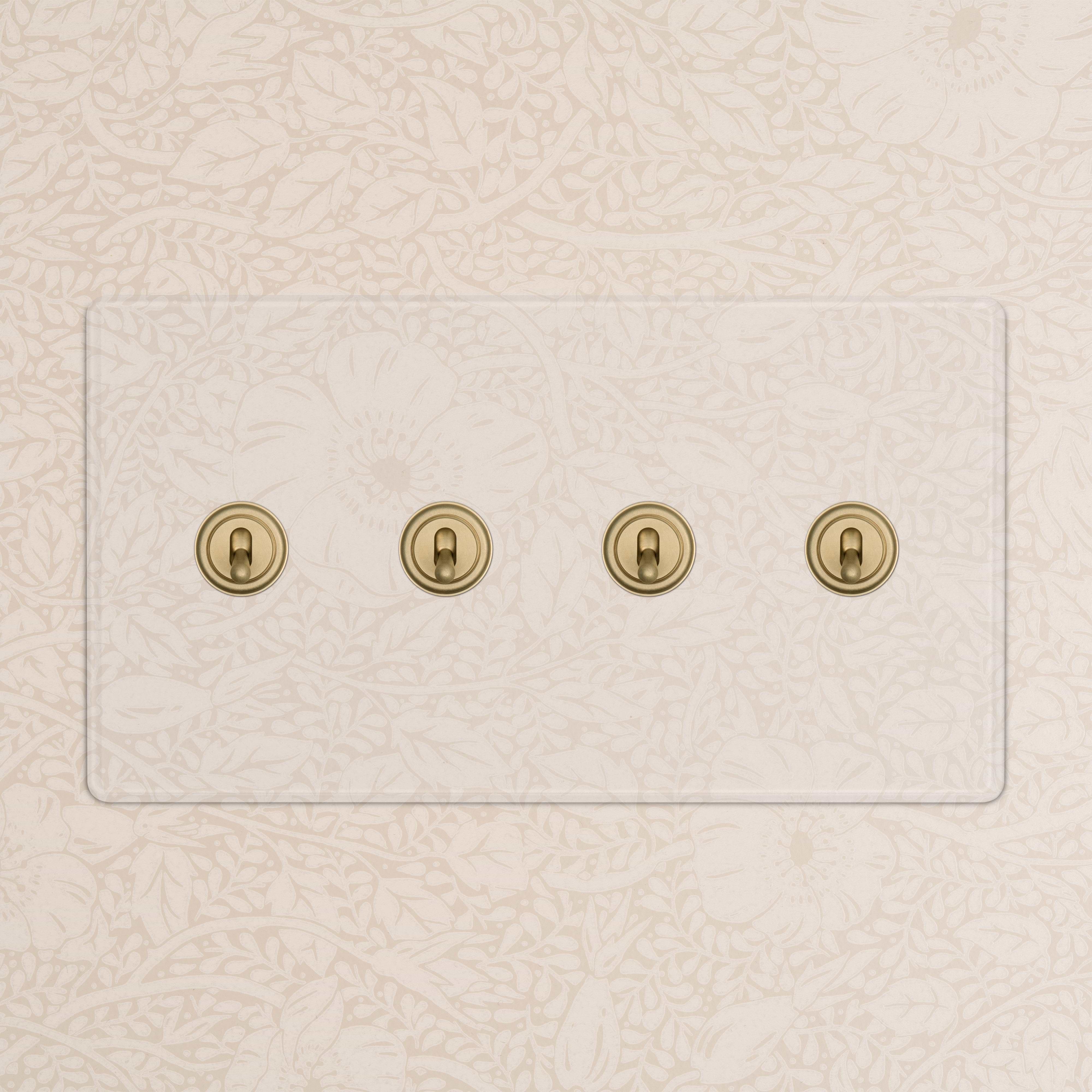 Kew 4G Toggle Switch in clear antique brass finish with four brass toggles, mounted on a wall.