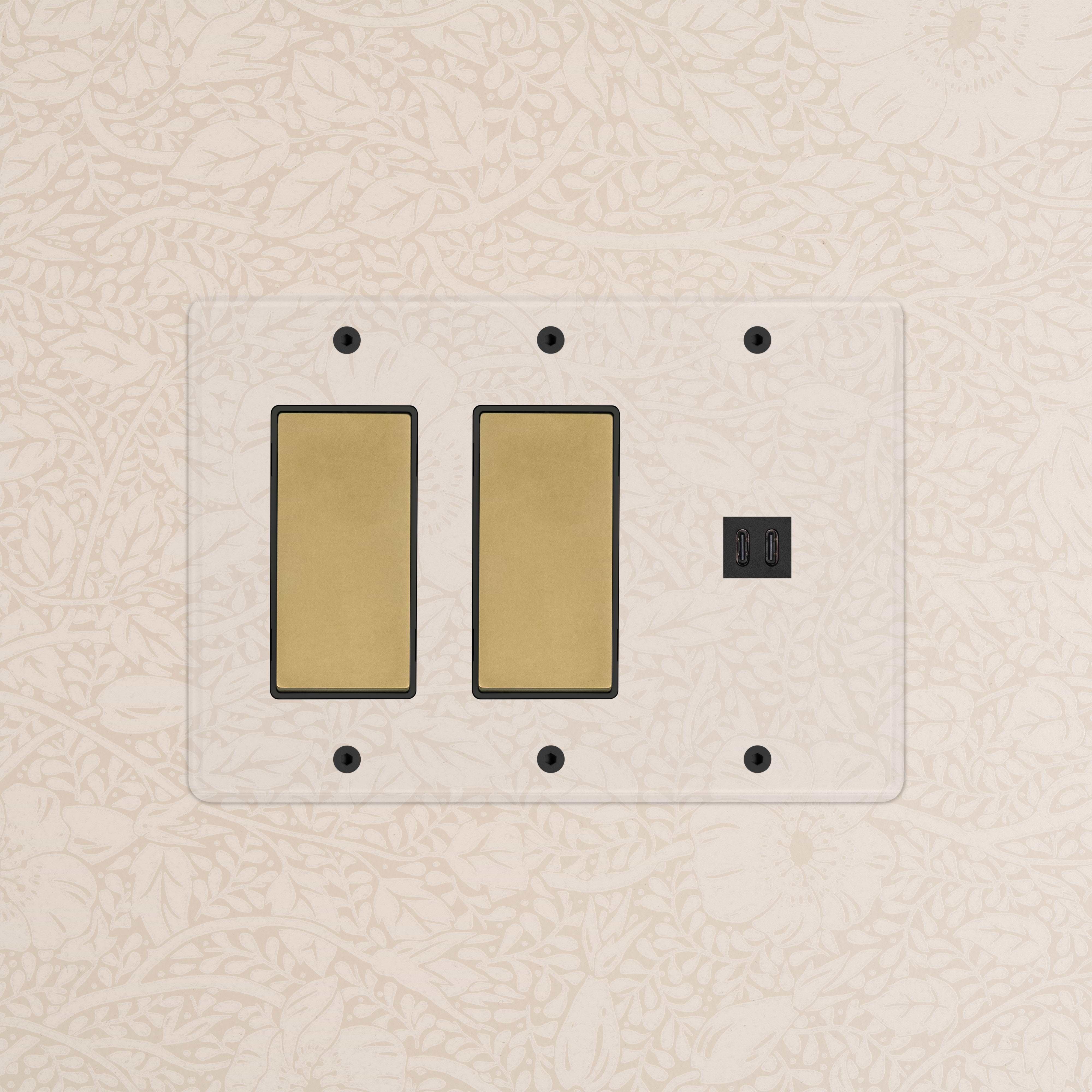 Clear antique brass and black 3-gang plate with 2 rocker switches and fast charge USB ports, wall-mounted.