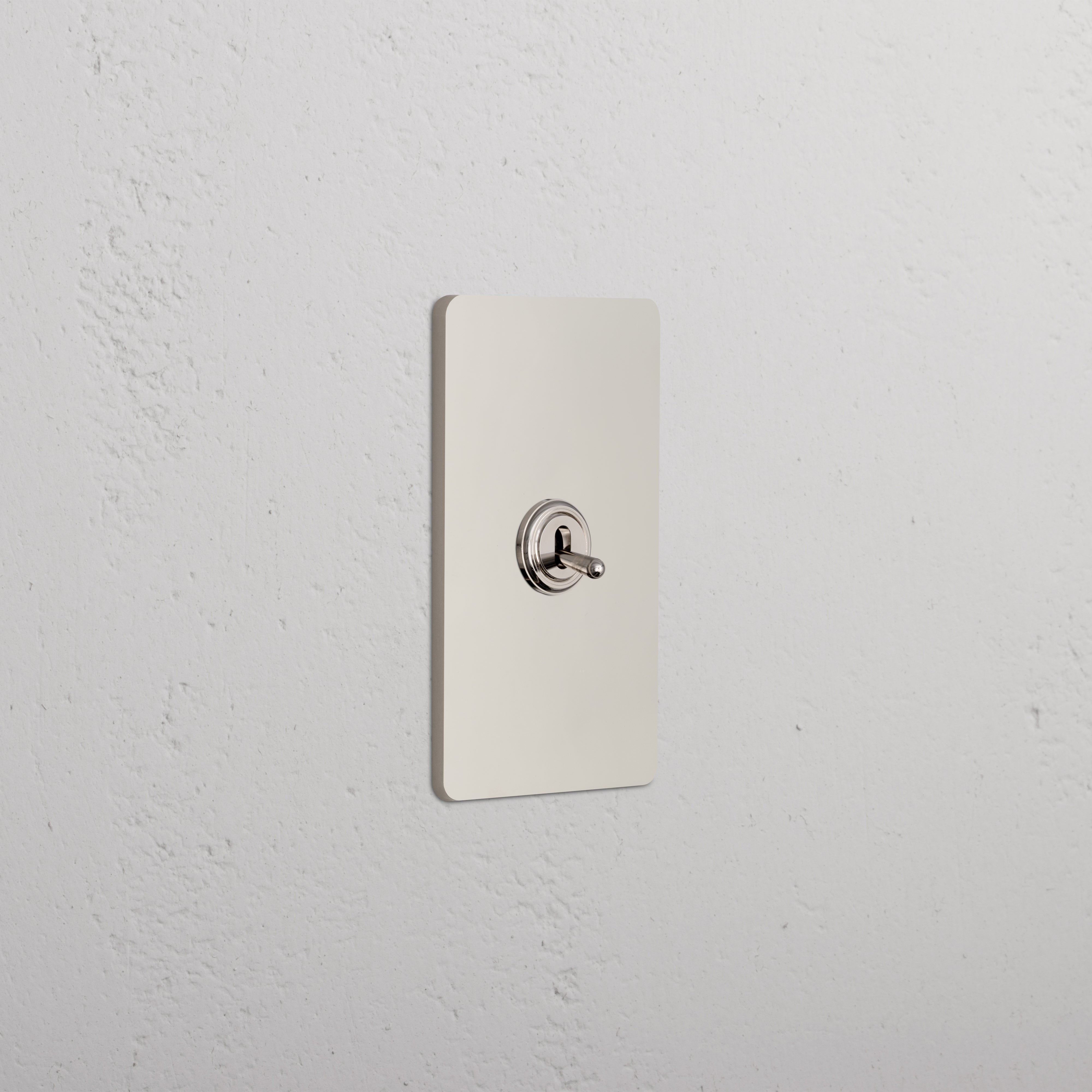 Grove 1G Four Way Toggle Switch in polished nickel, single gang, shown mounted on a white textured wall.
