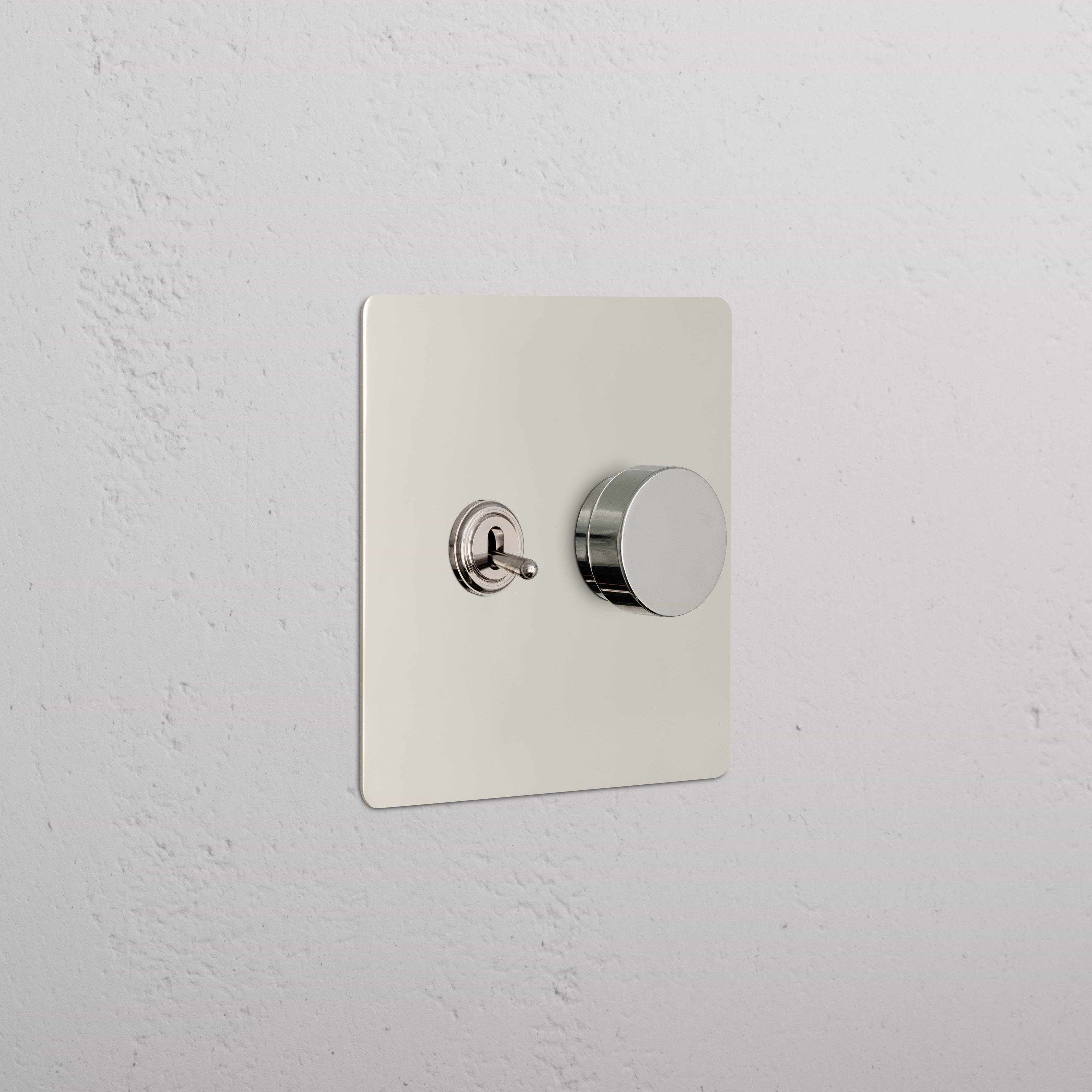 Kew 2G Toggle & Dimmer Switch in polished nickel with toggle lever and round dimmer knob on square plate.