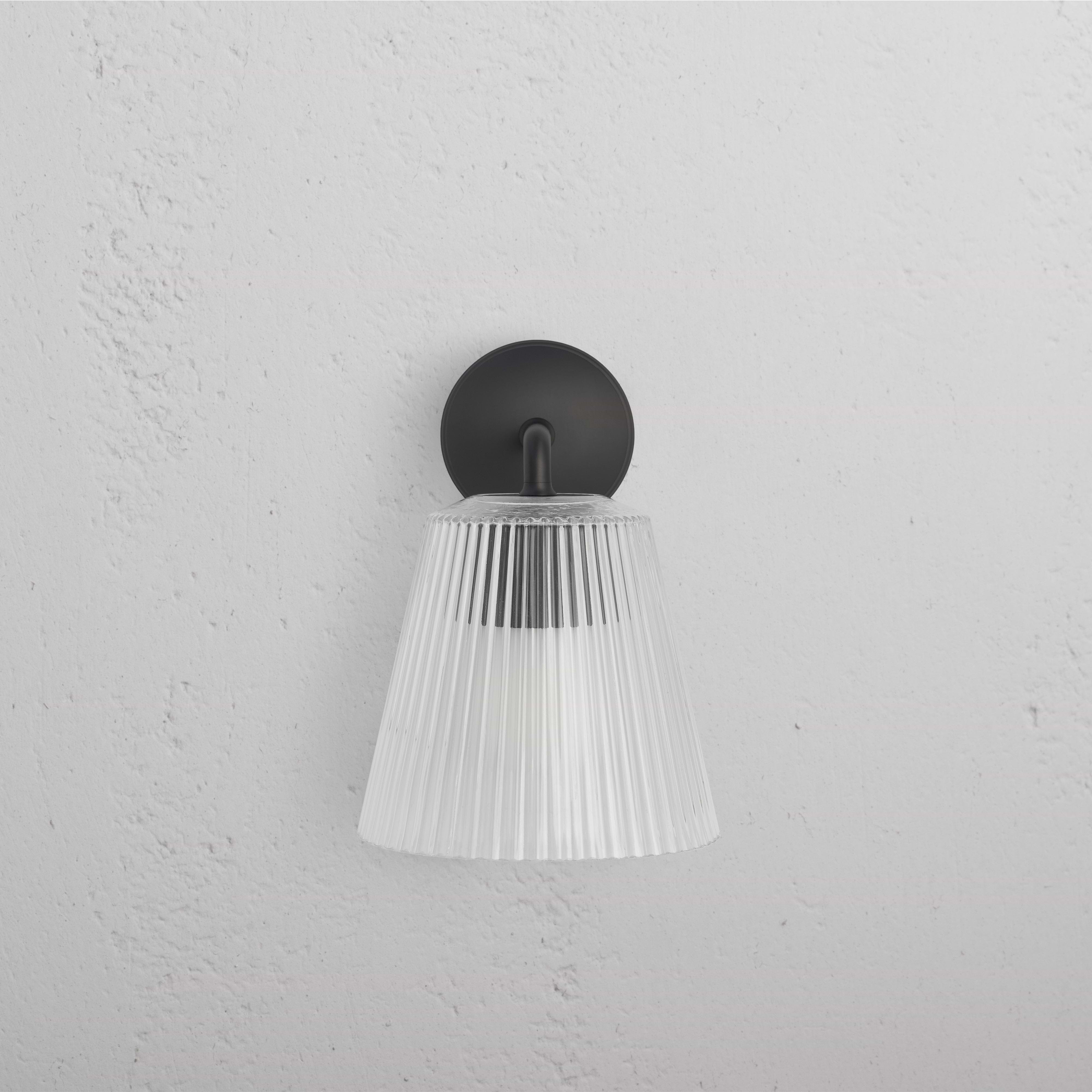 Large Richmond Wall Light Fluted Glass in bronze finish with ribbed clear glass shade, mounted on a wall.