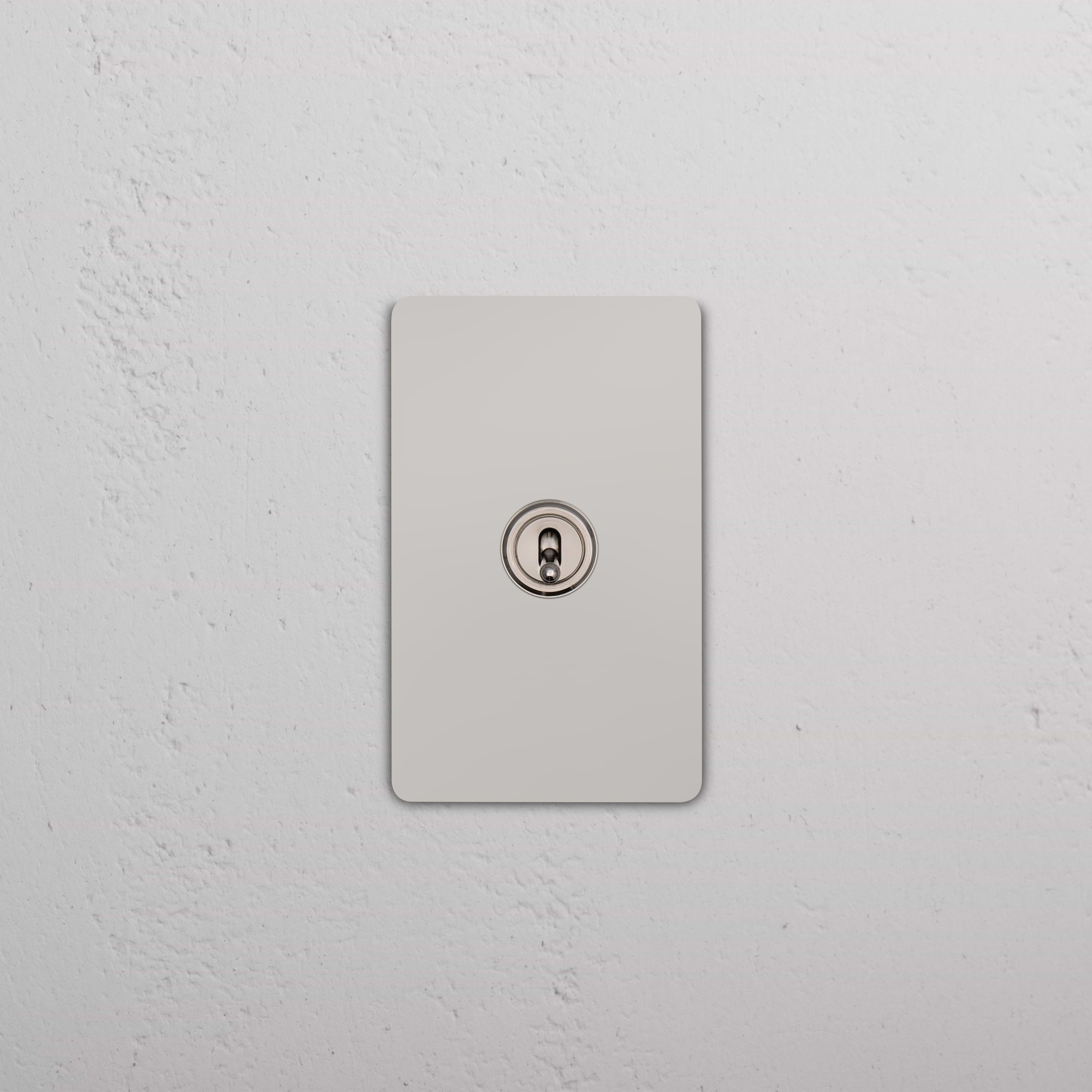 Grove 1G Double Pole Toggle Switch in Polished Nickel, mounted on a rectangular wall plate.