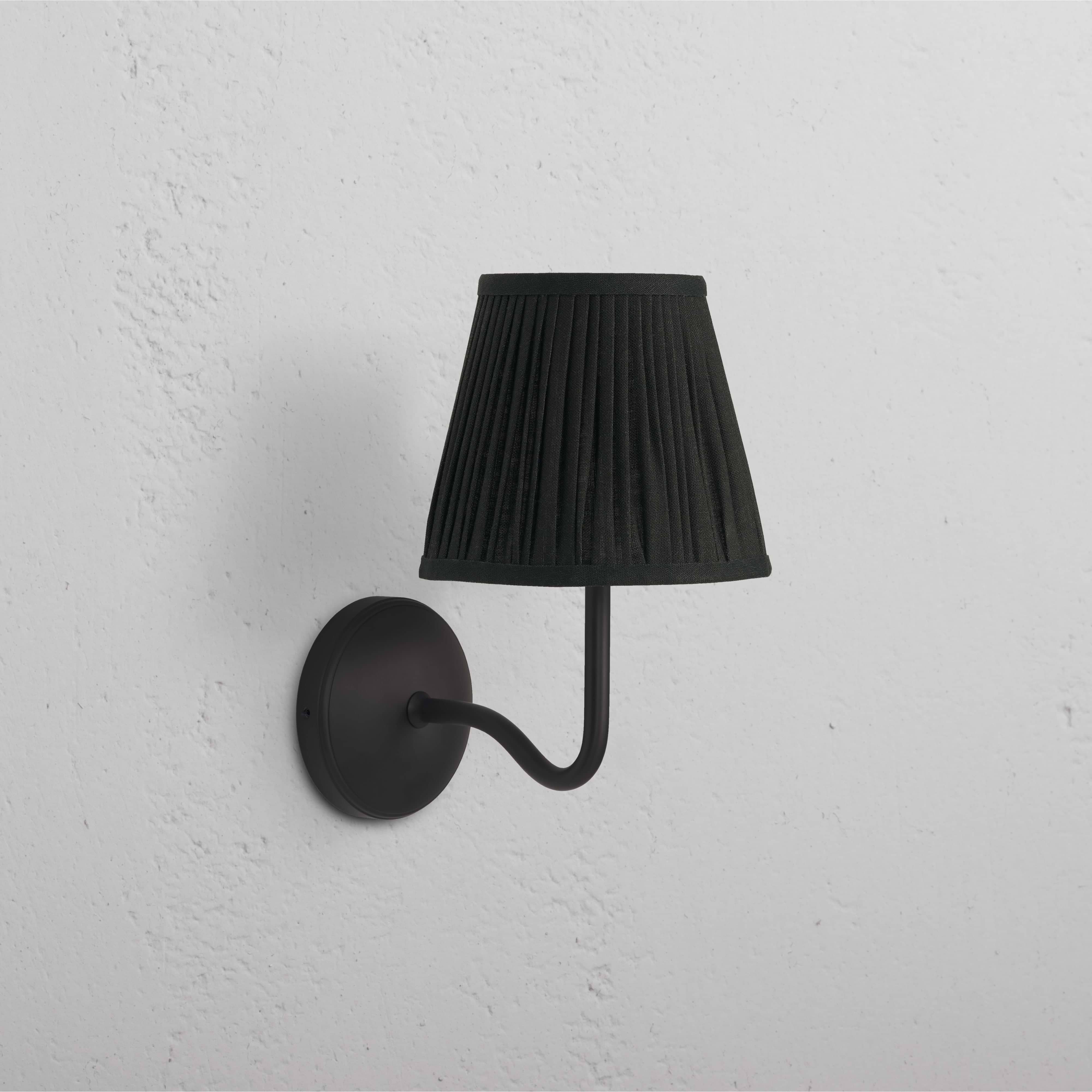 Malvern Medium Wall Light in deep green with bronze fittings, featuring a curved arm and dome-shaped shade.