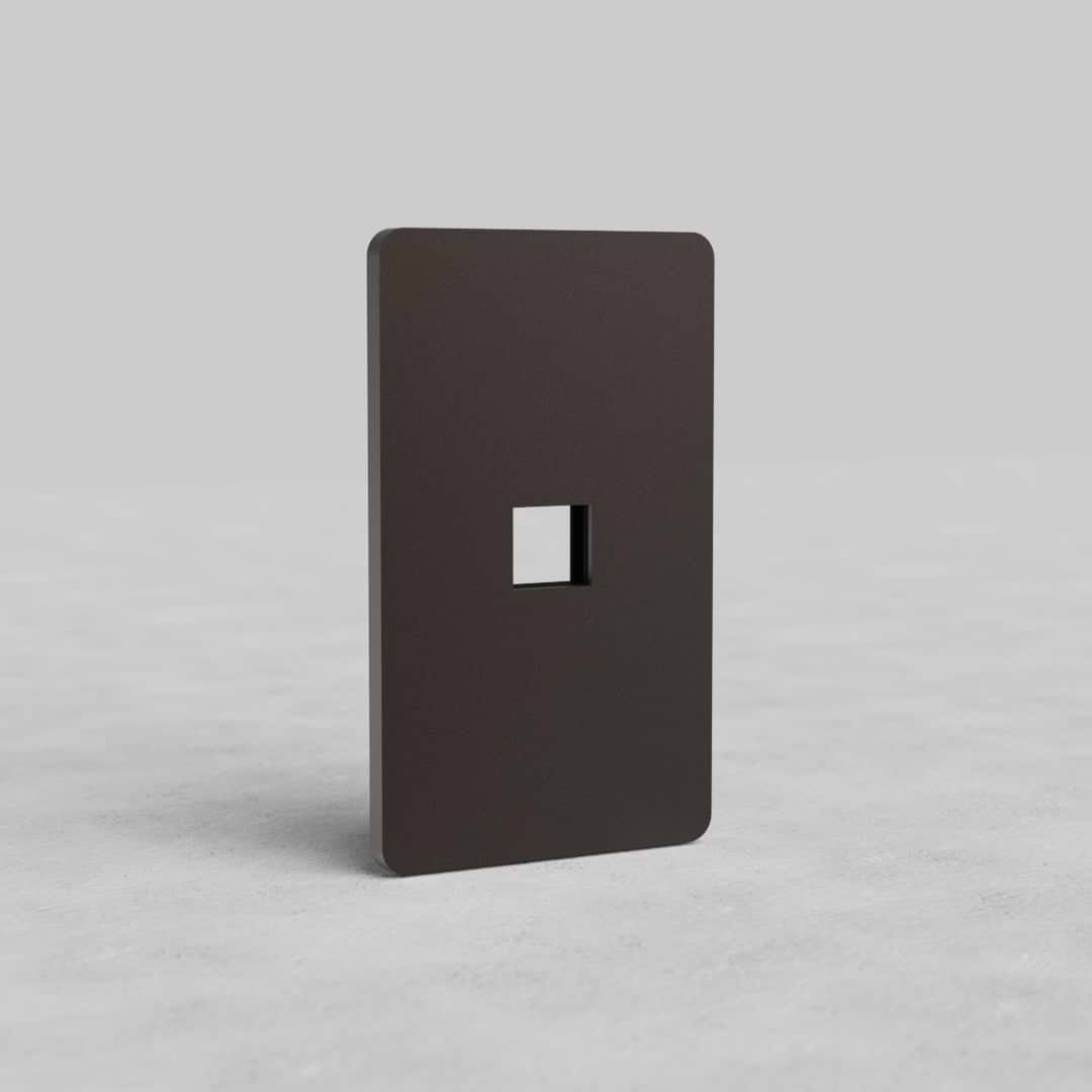1G Keystone Plate Grove US in bronze finish with a single keystone cutout, shown on a gray background.