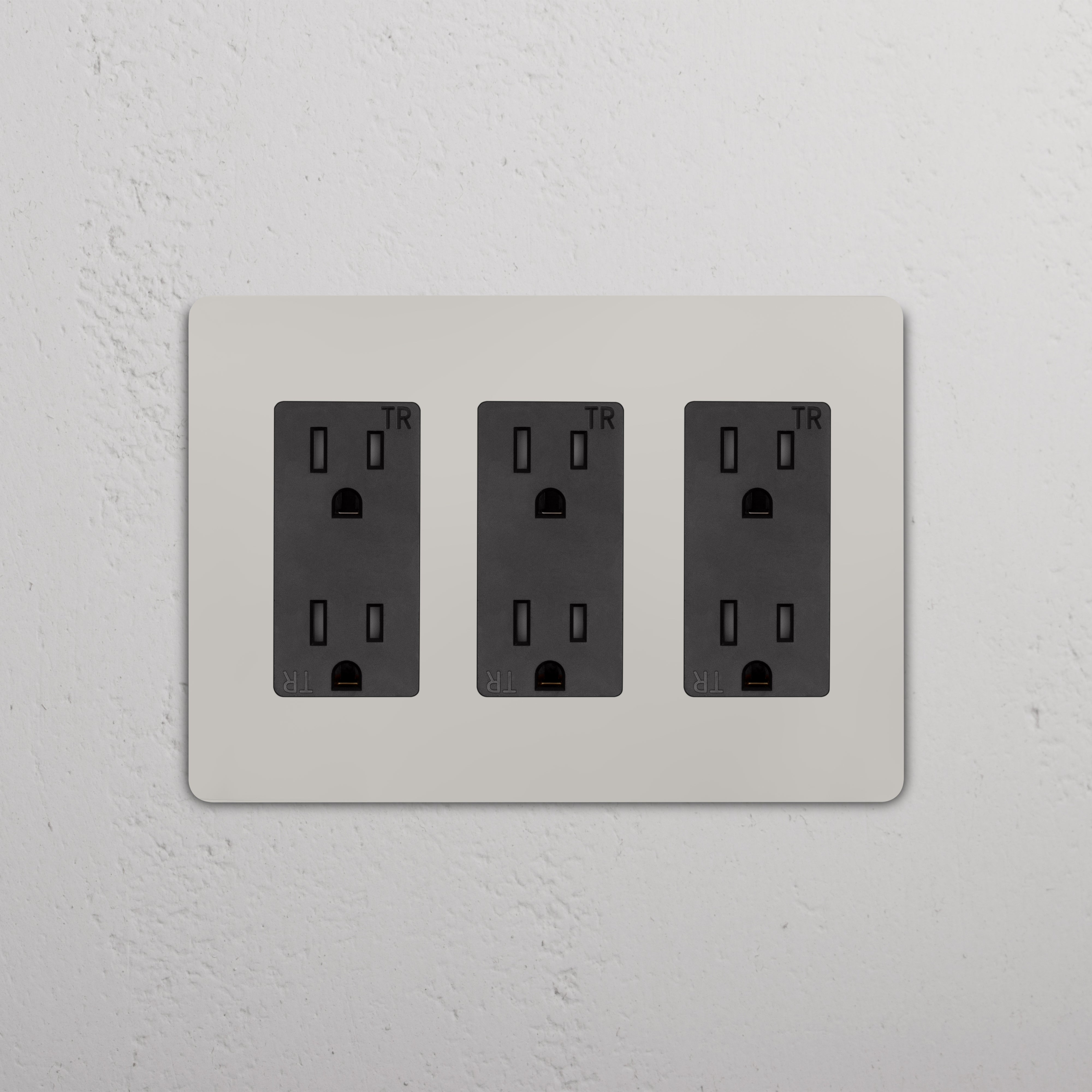 Grove 3G Outlet in Polished Nickel Black, featuring three black electrical outlets on a sleek wall plate.