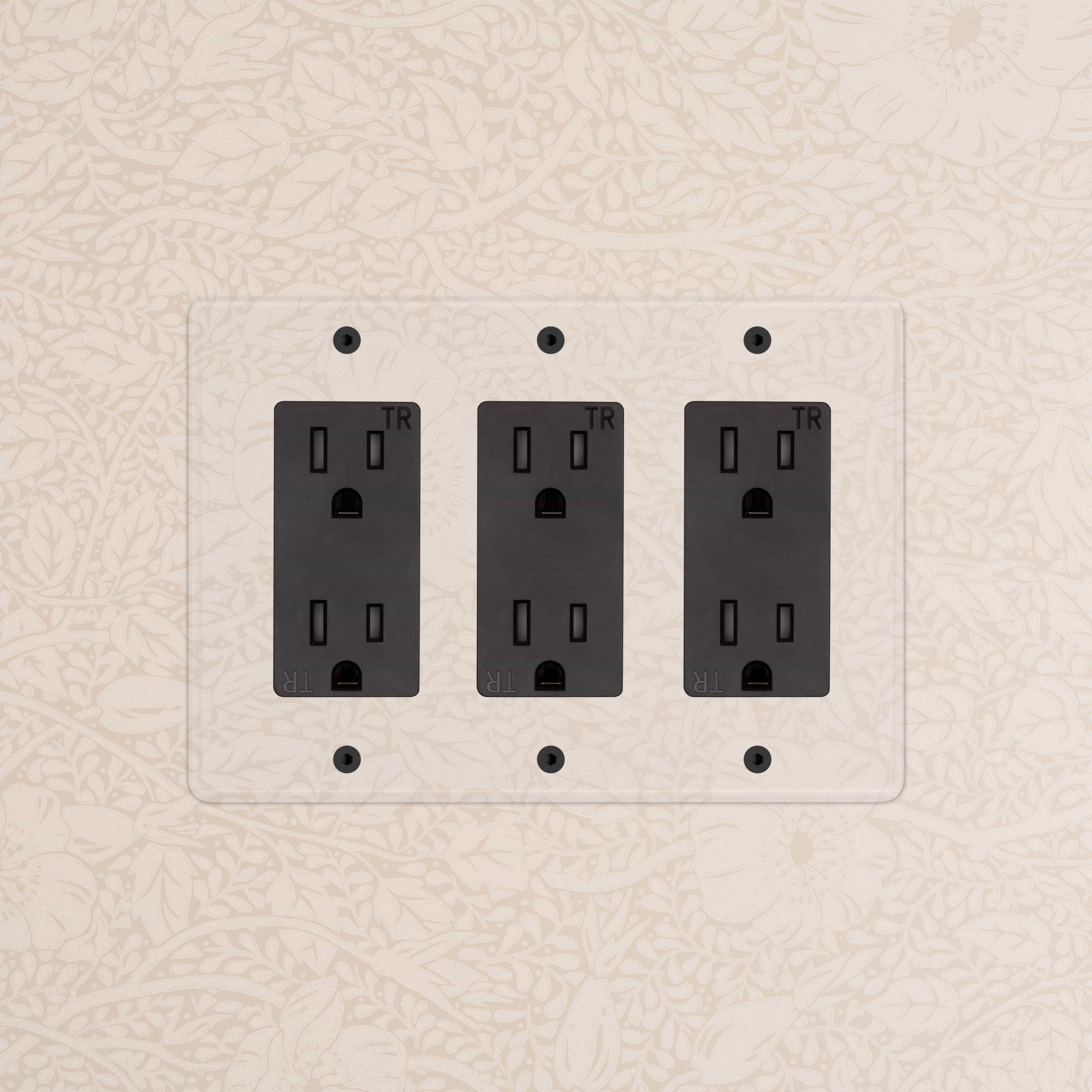 Kew 3G Outlet in Clear Black finish shown mounted on a wall with clear plastic cover.