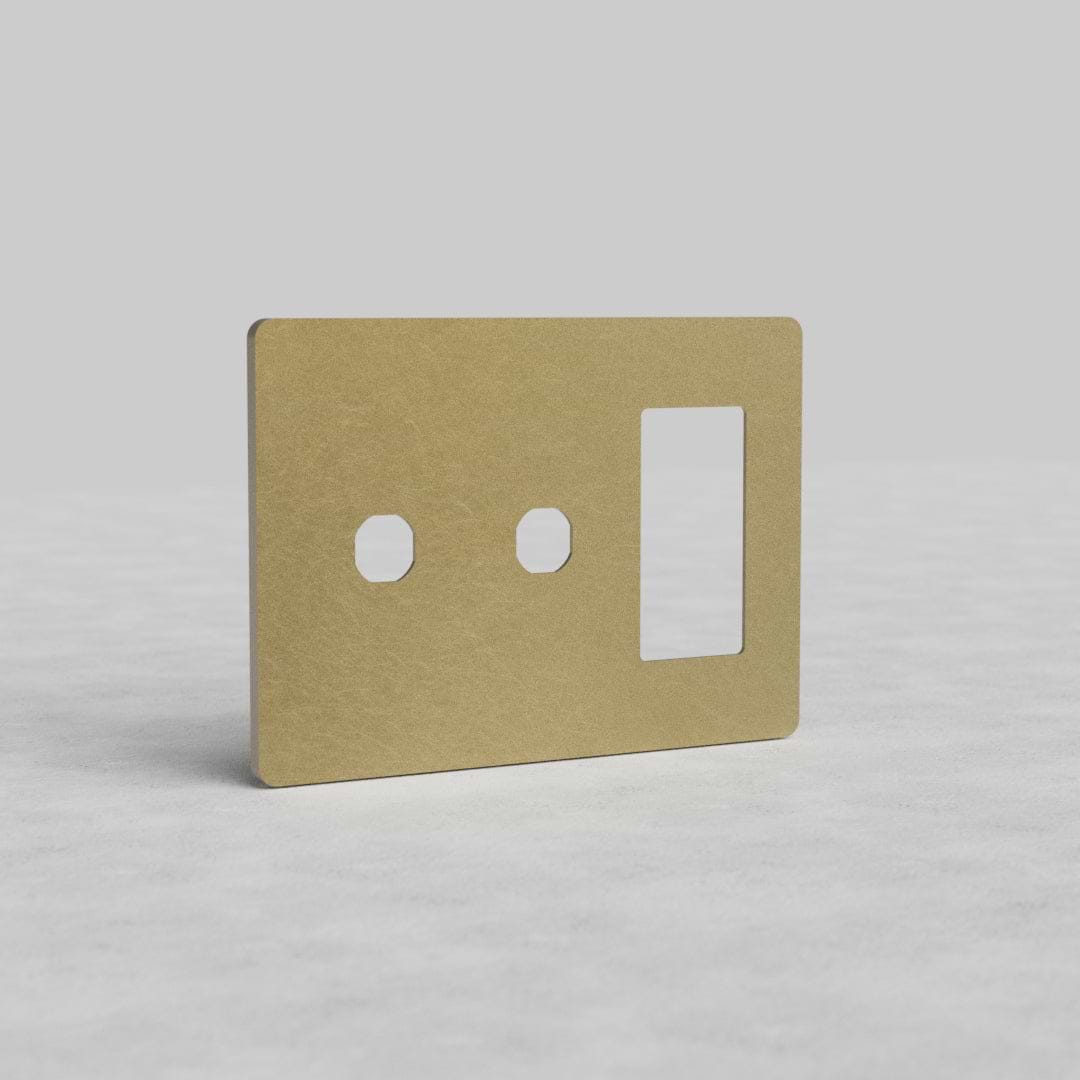Antique brass 3G 2x switch and outlet plate, Grove US style, with two switch cutouts and one outlet opening.