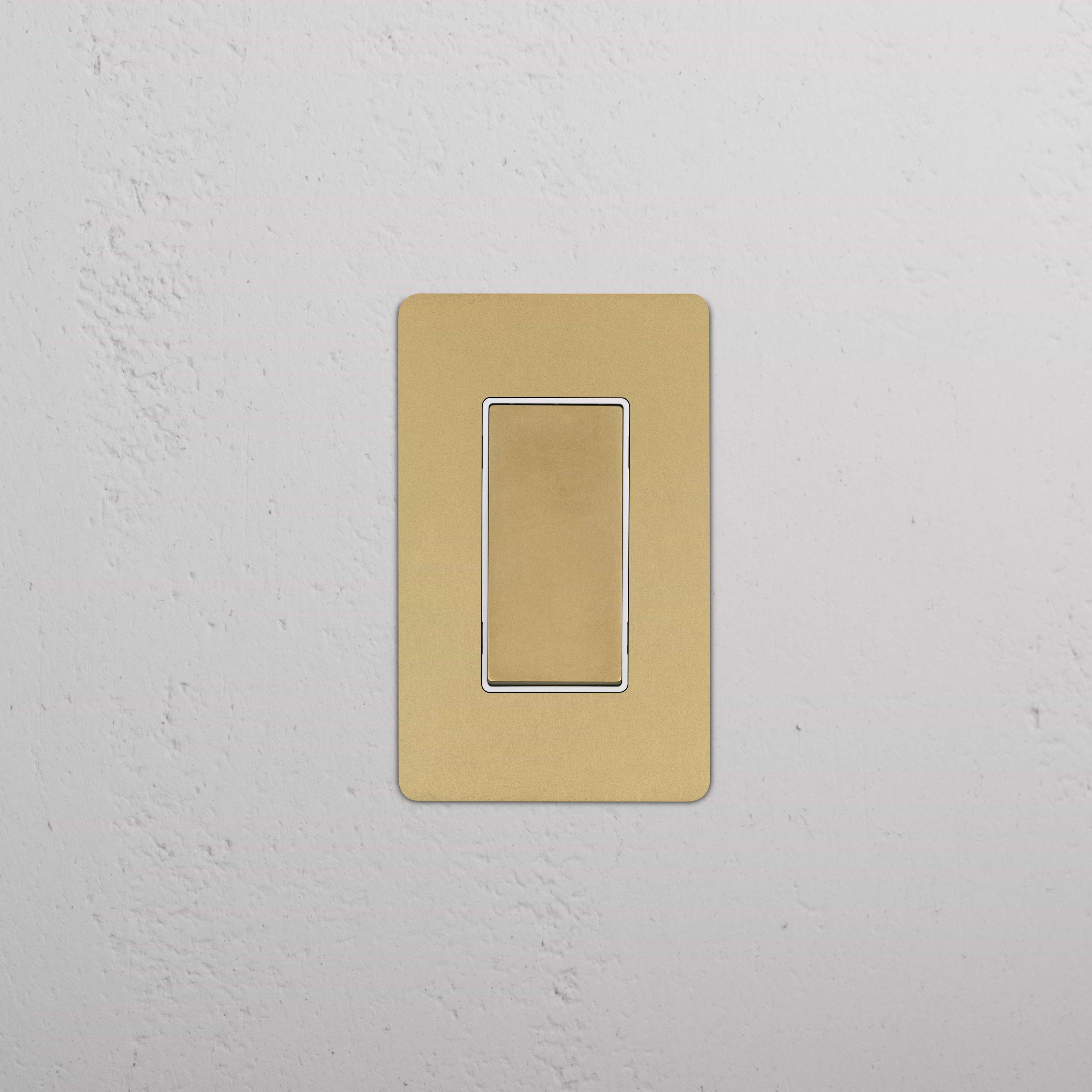 Kew 1G Retractive Rocker Switch in Antique Brass White, single switch with plain gold-colored plate.