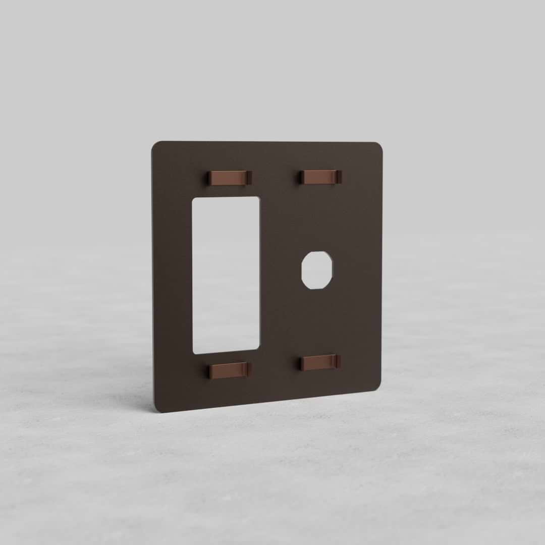 Bronze 2-gang switch and outlet plate (Kew US) with rectangular and circular cutouts, shown upright.