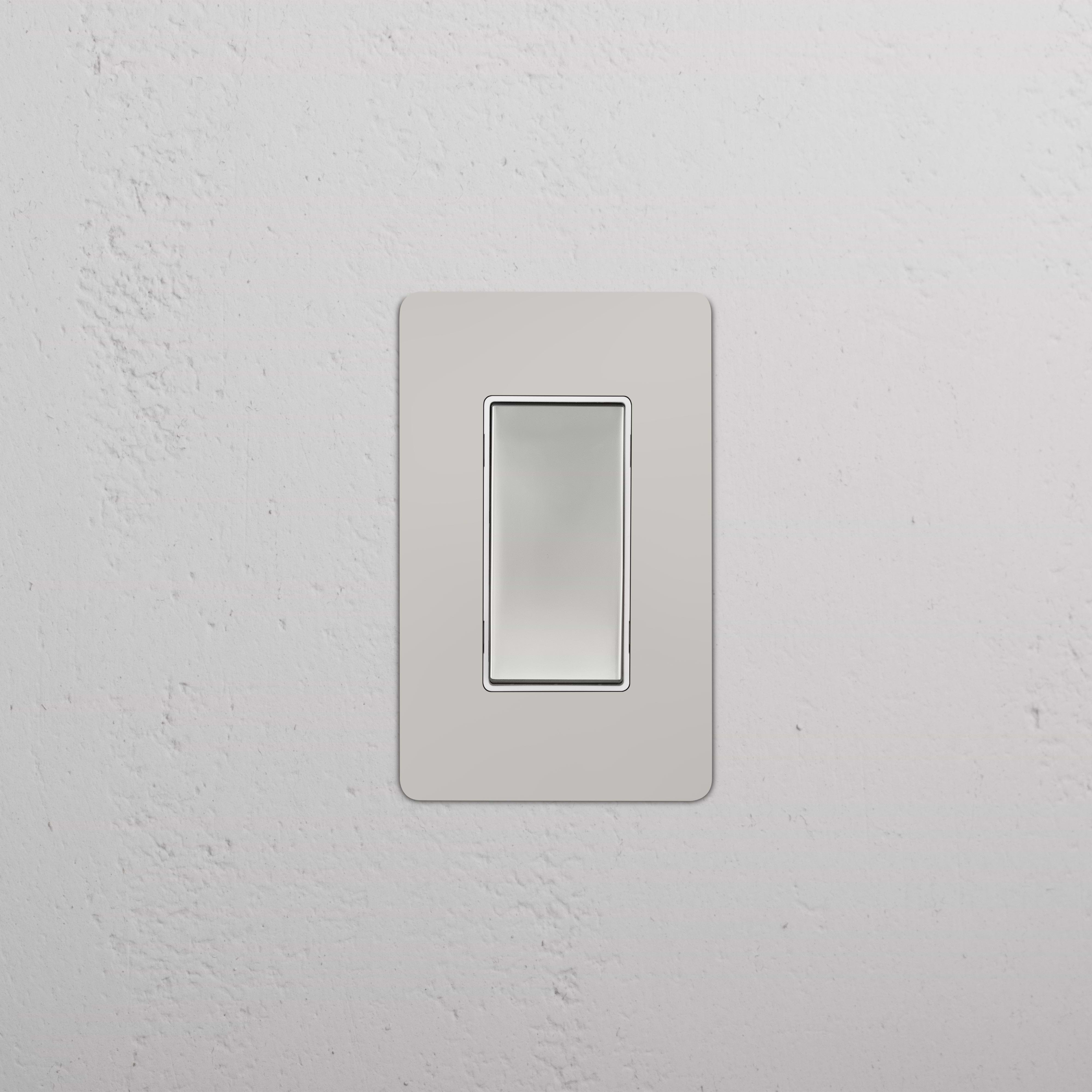 Kew 1G Four Way Rocker Switch in Polished Nickel White, shown installed on a white wall.