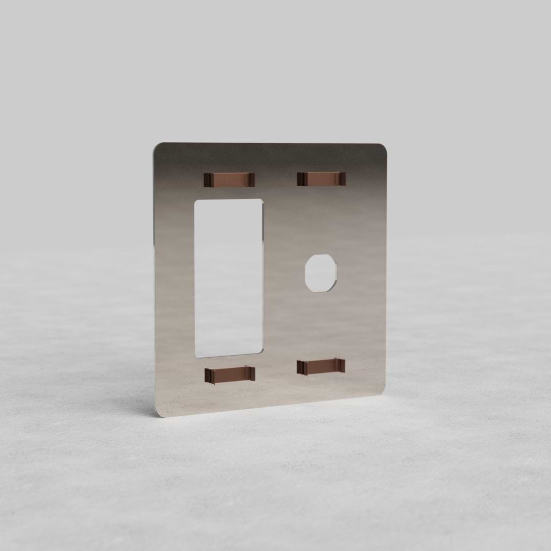 Polished nickel 2G switch & outlet plate Kew US with rectangular and circular cutouts, on a light surface.