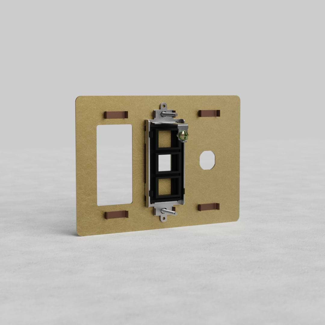 Antique brass 3-gang outlet, keystone, and switch plate (Kew US) with black switch and openings.