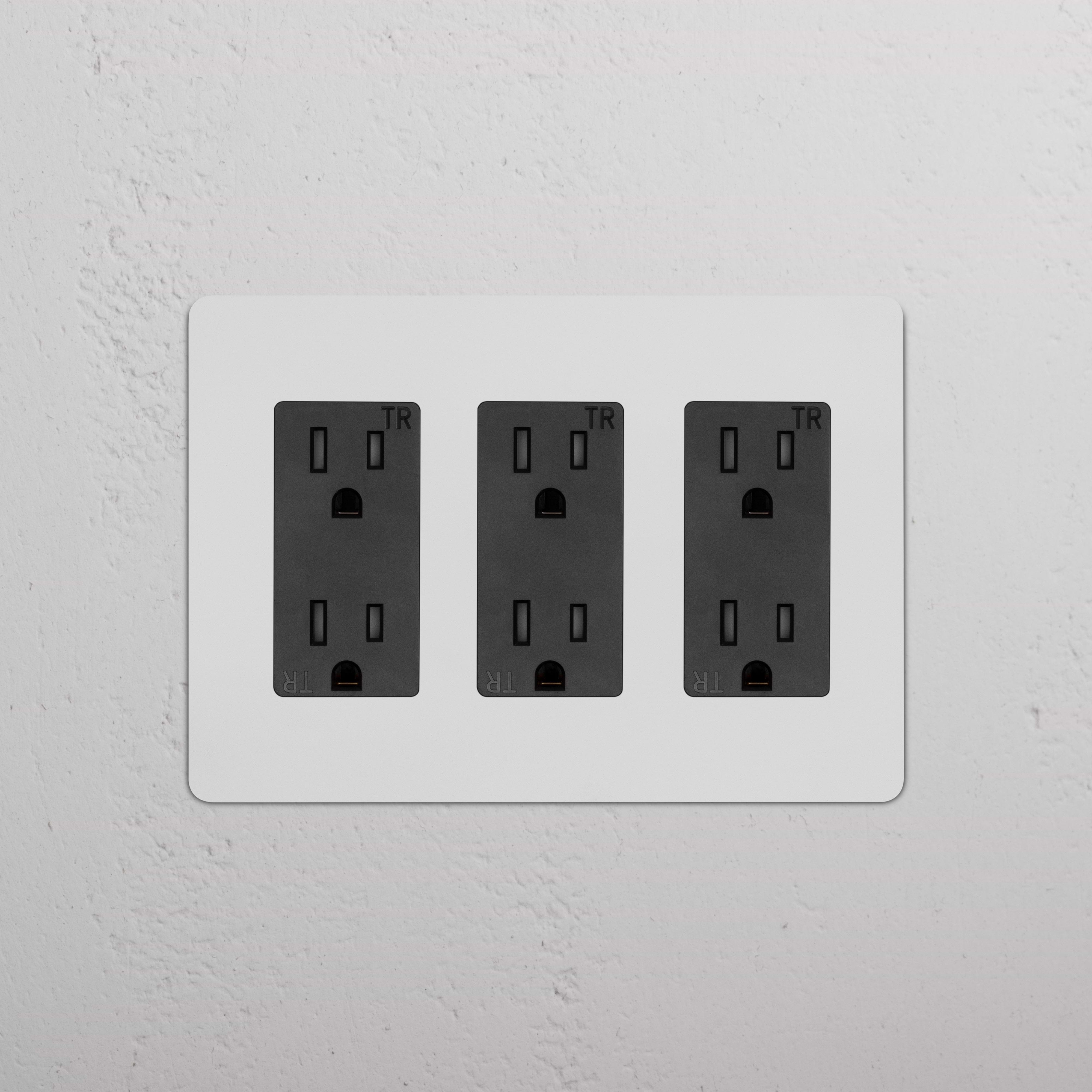Kew 3G Outlet - Paintable Black electrical outlet with three paintable black sockets on a wall plate.