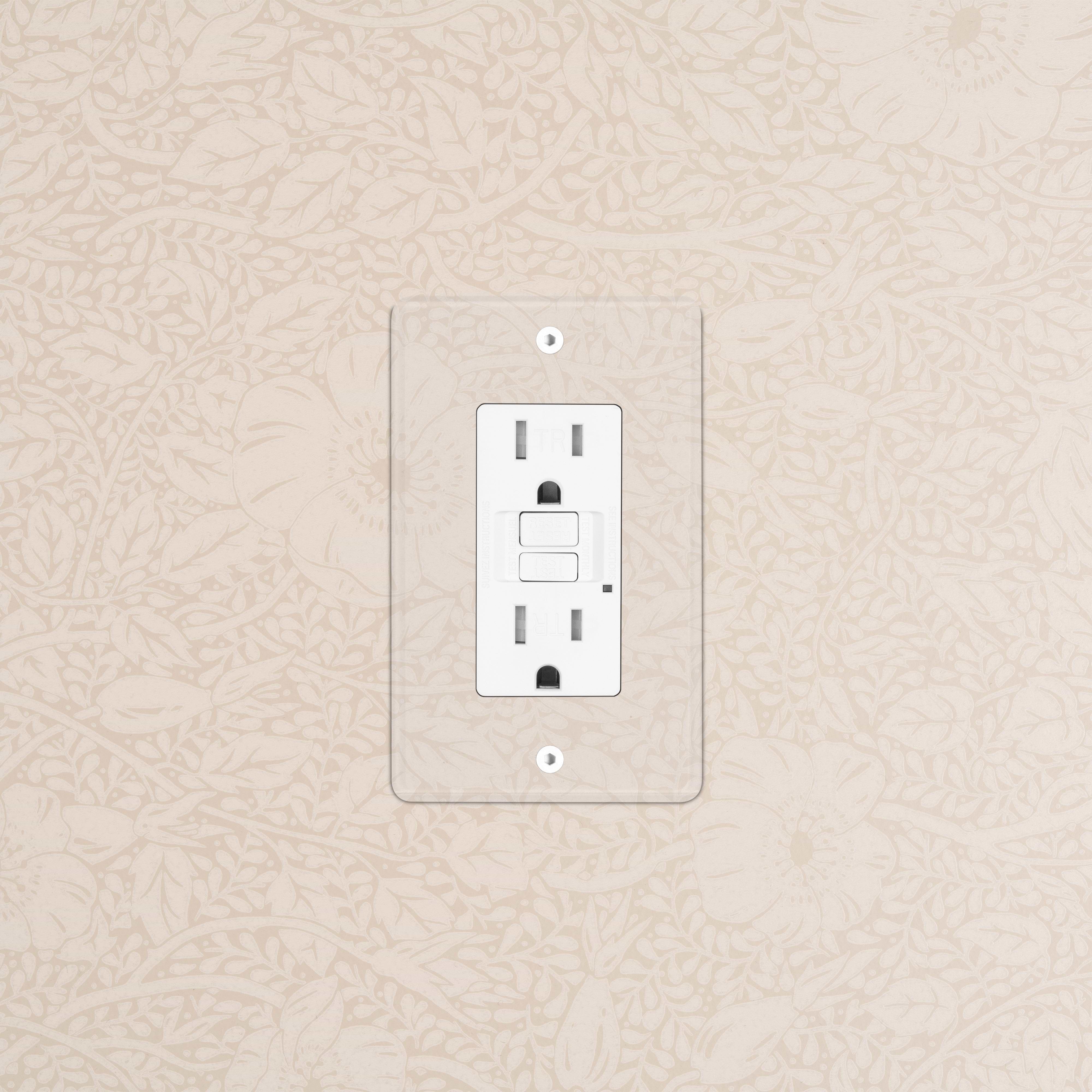 Kew 1G 15A GFCI Outlet in clear white with two sockets and test/reset buttons, mounted on a wall.
