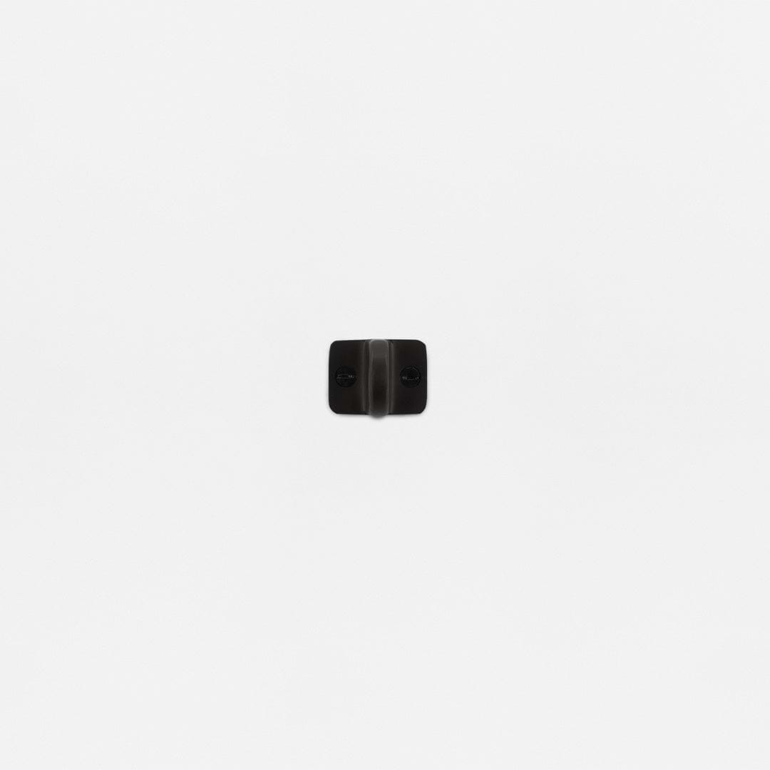 Bronze Belmont Single Hung Window Ring with two screw holes mounted on a plain white wall.