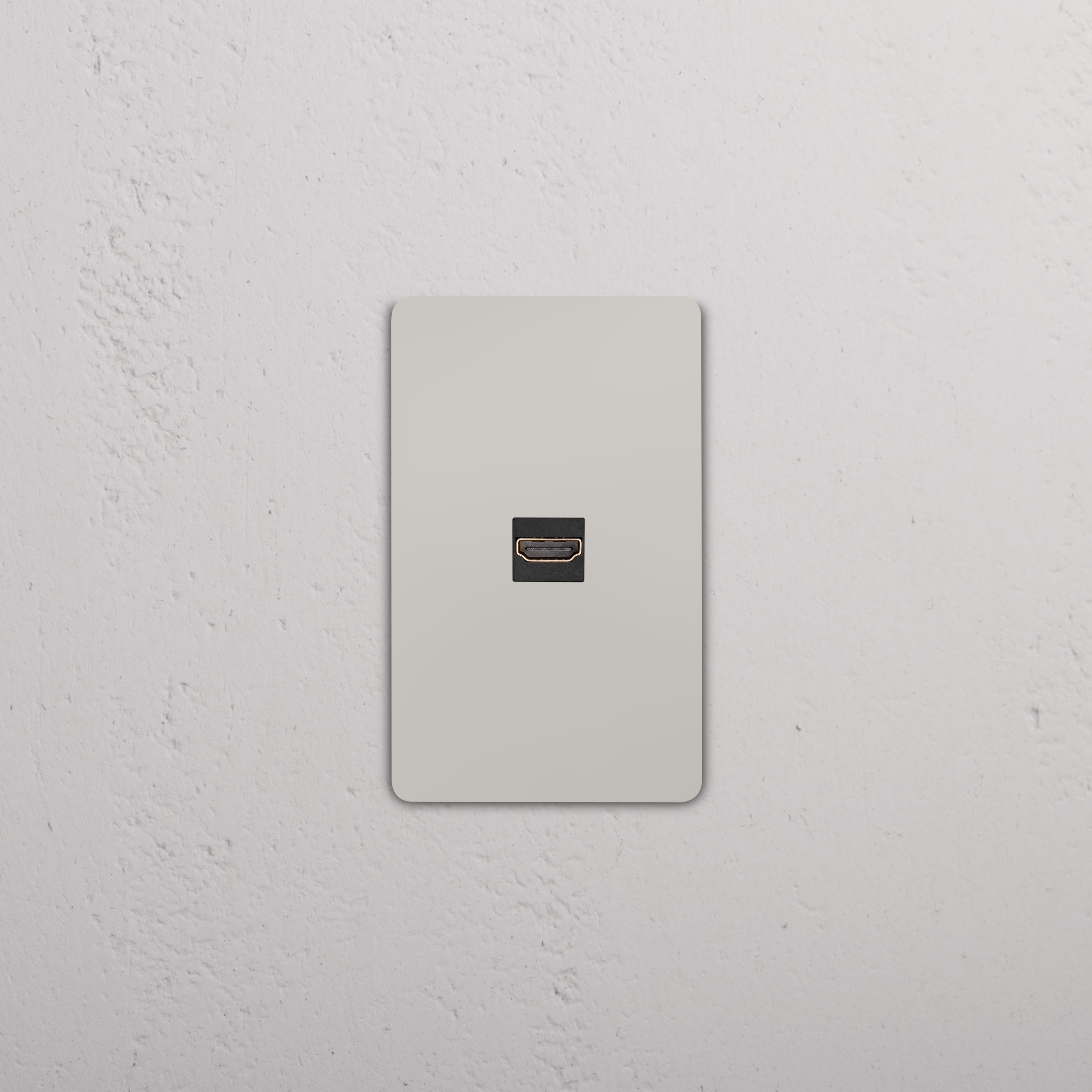 Grove 1G HDMI Keystone wall plate in polished nickel with black HDMI port, shown mounted on a wall.
