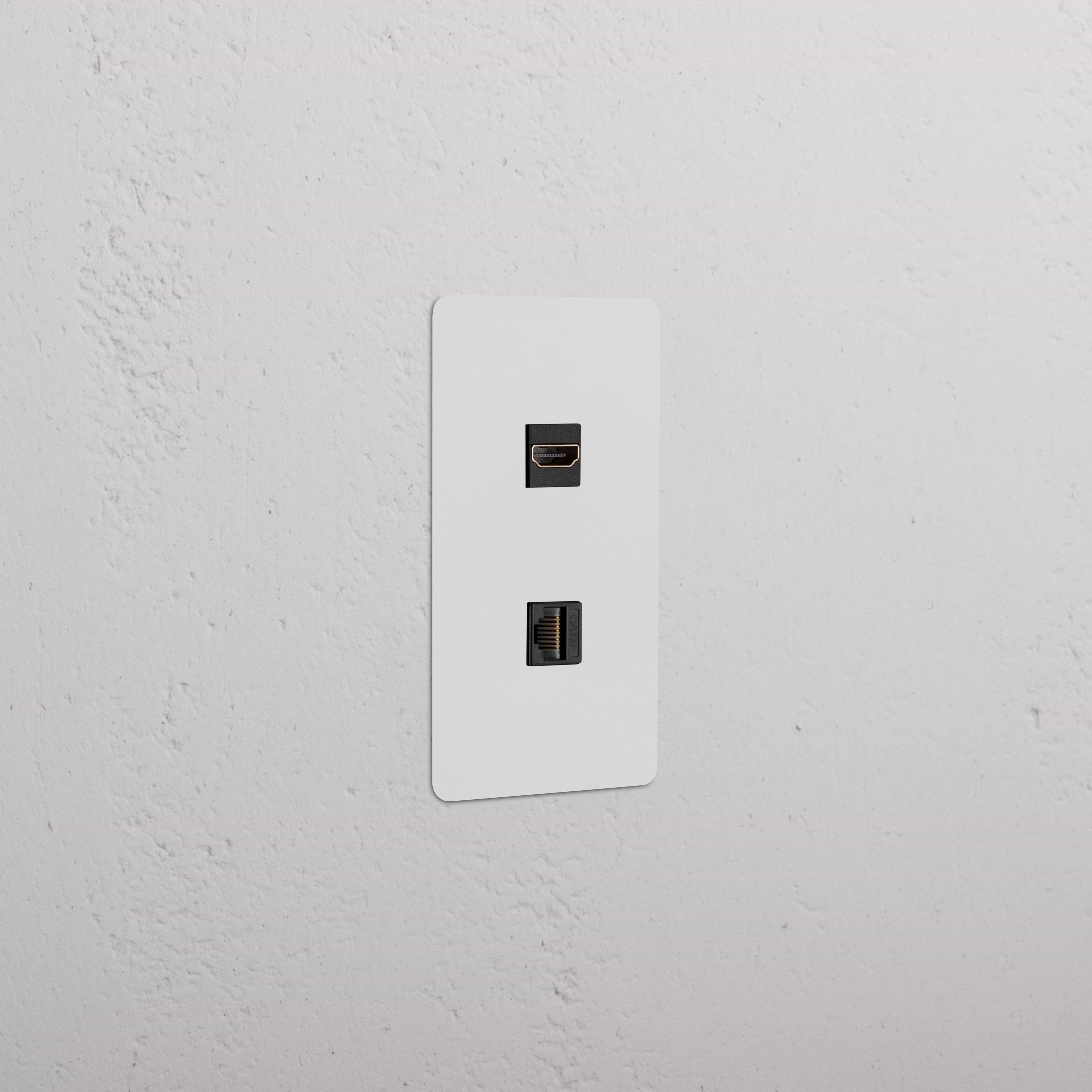 Kew 1G HDMI & CAT 6 Keystone, paintable black faceplate with two ports, installed on a wall.