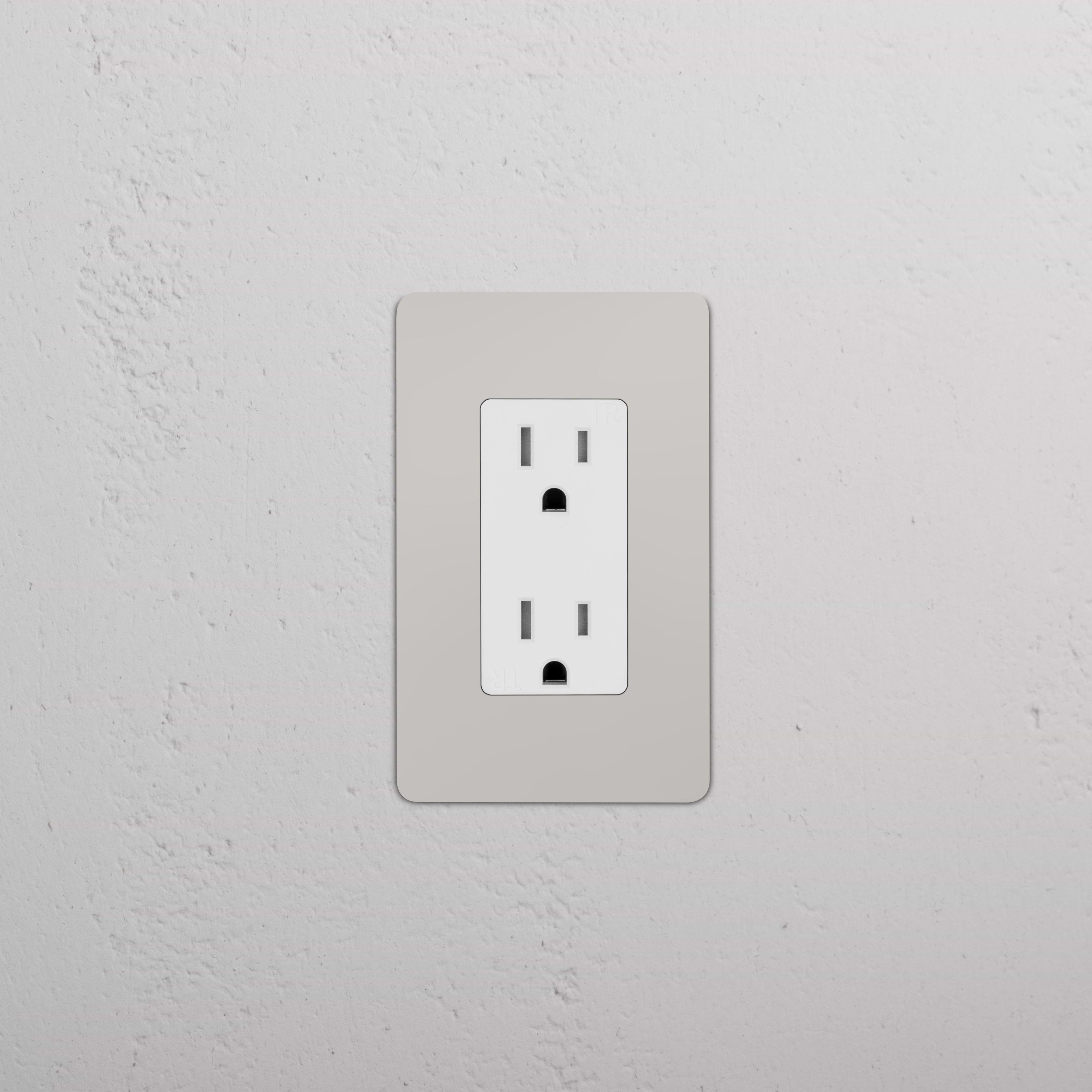 Kew 1G 15A electrical outlet in polished nickel white finish, mounted on a light-colored wall.