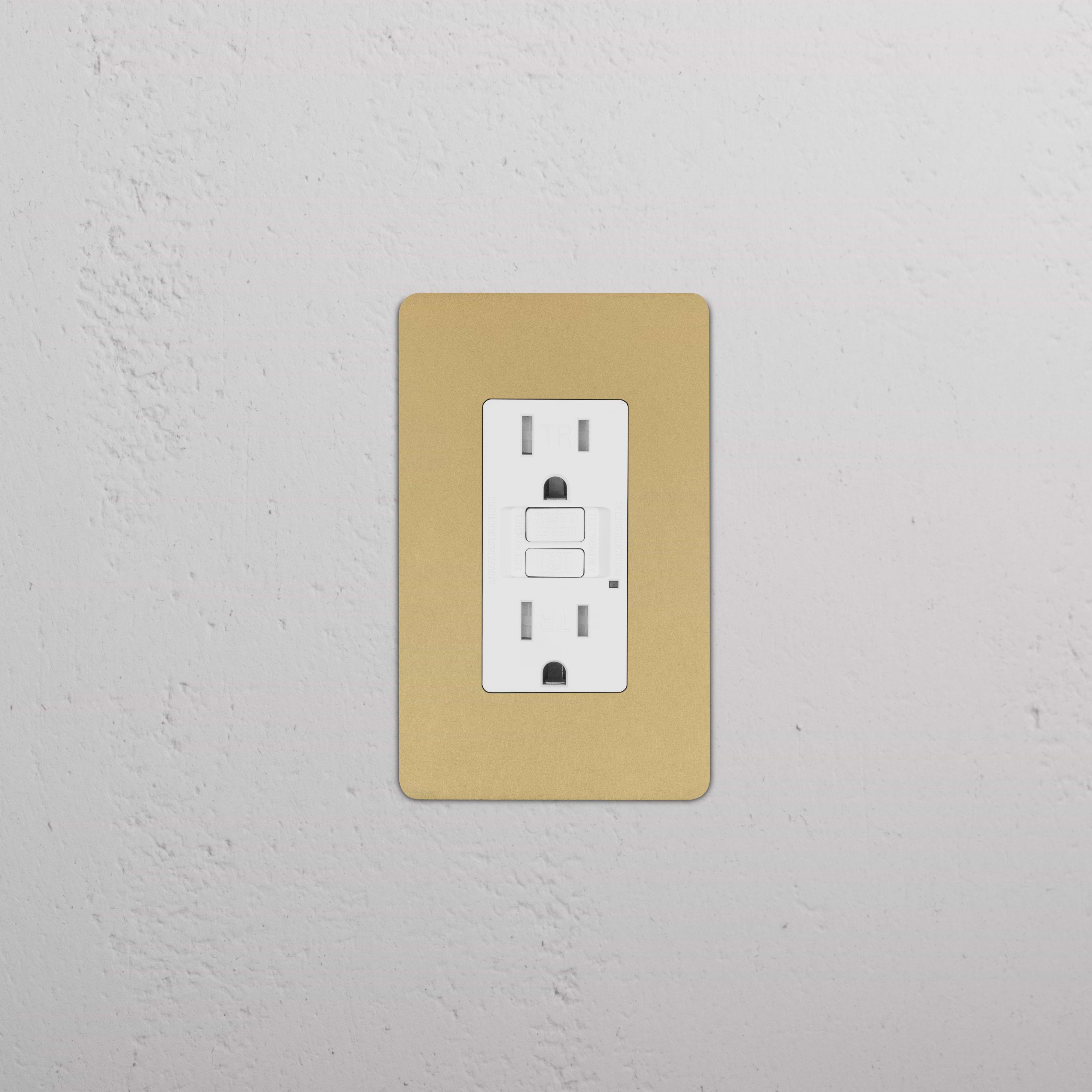 Kew 1G 15A GFCI Outlet in antique brass with white insert, showing two sockets and a reset button.
