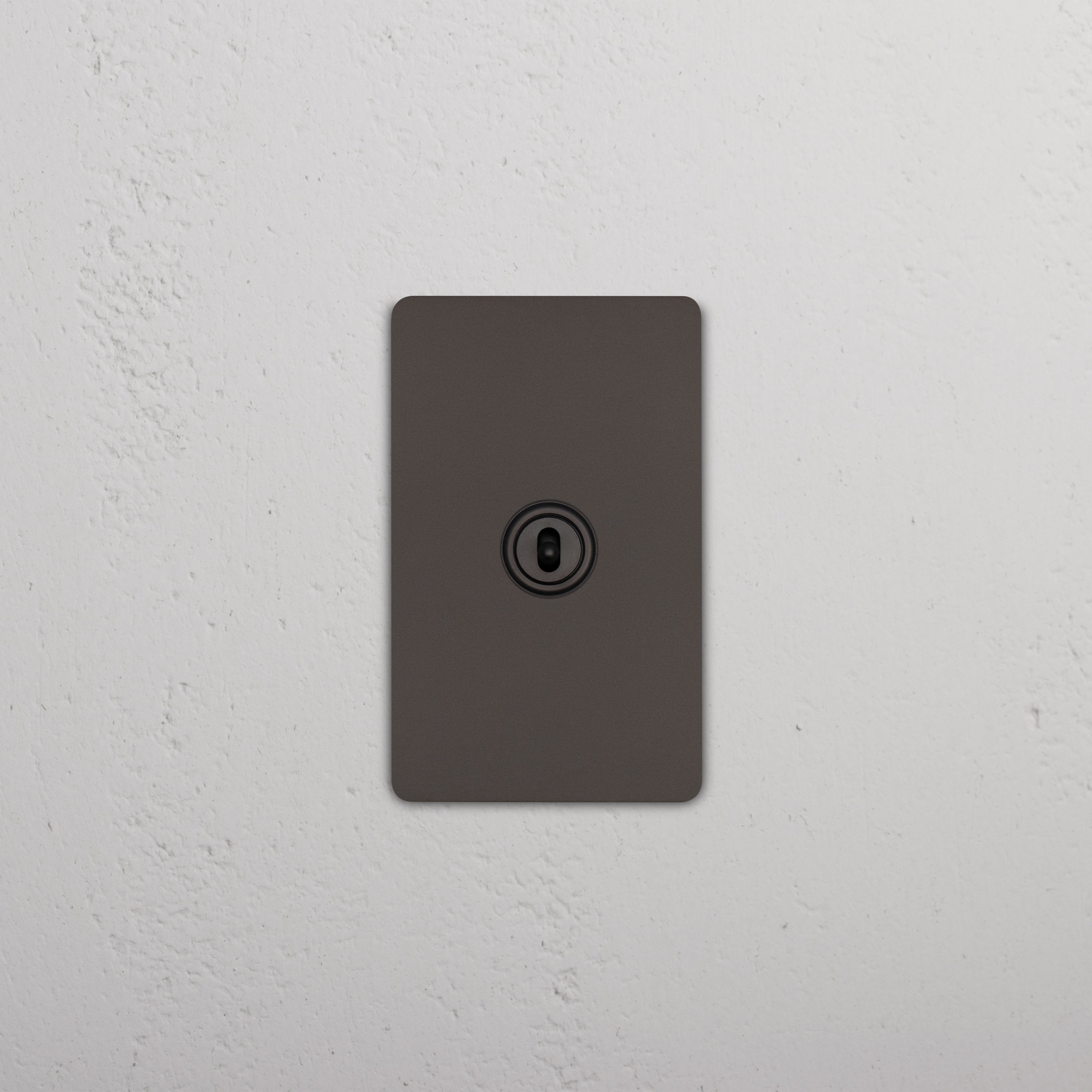 Bronze Grove 1G Center Retractive Toggle Switch with centered toggle on a rectangular wall plate.