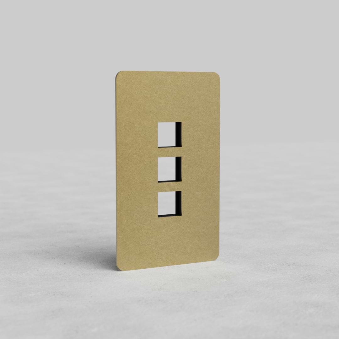 Antique Brass 1G 3x Keystone Plate Kew US with three keystone module openings, shown on a gray background.