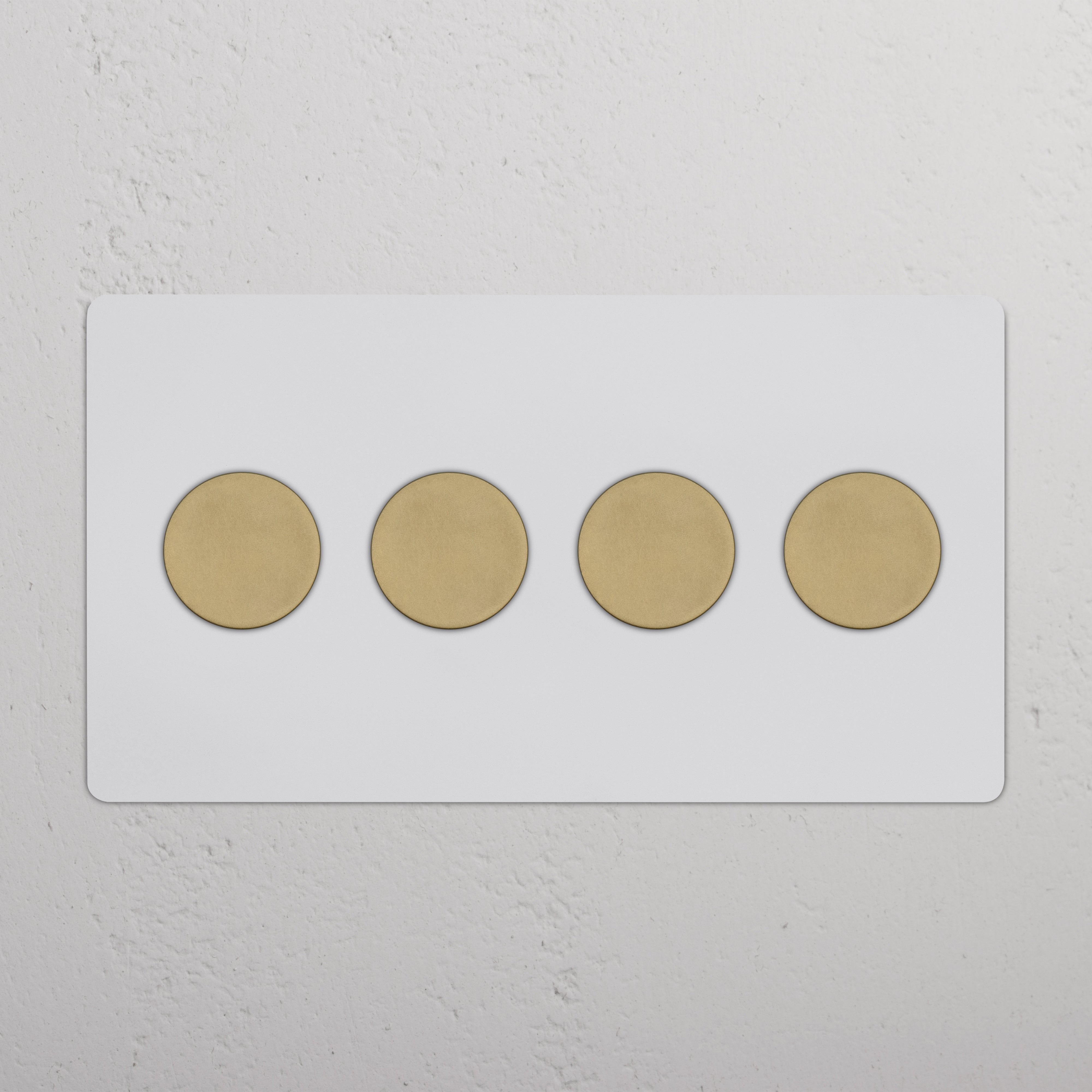 Kew 4G Dimmer Switch in paintable antique brass with four round knobs on a rectangular plate.
