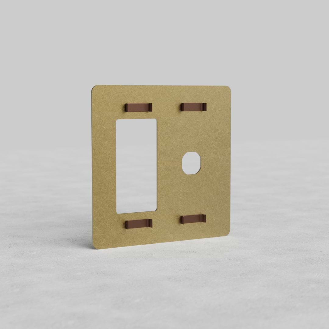 Antique brass 2G switch and outlet plate (Kew US), rectangular with cutouts for switches and outlet.