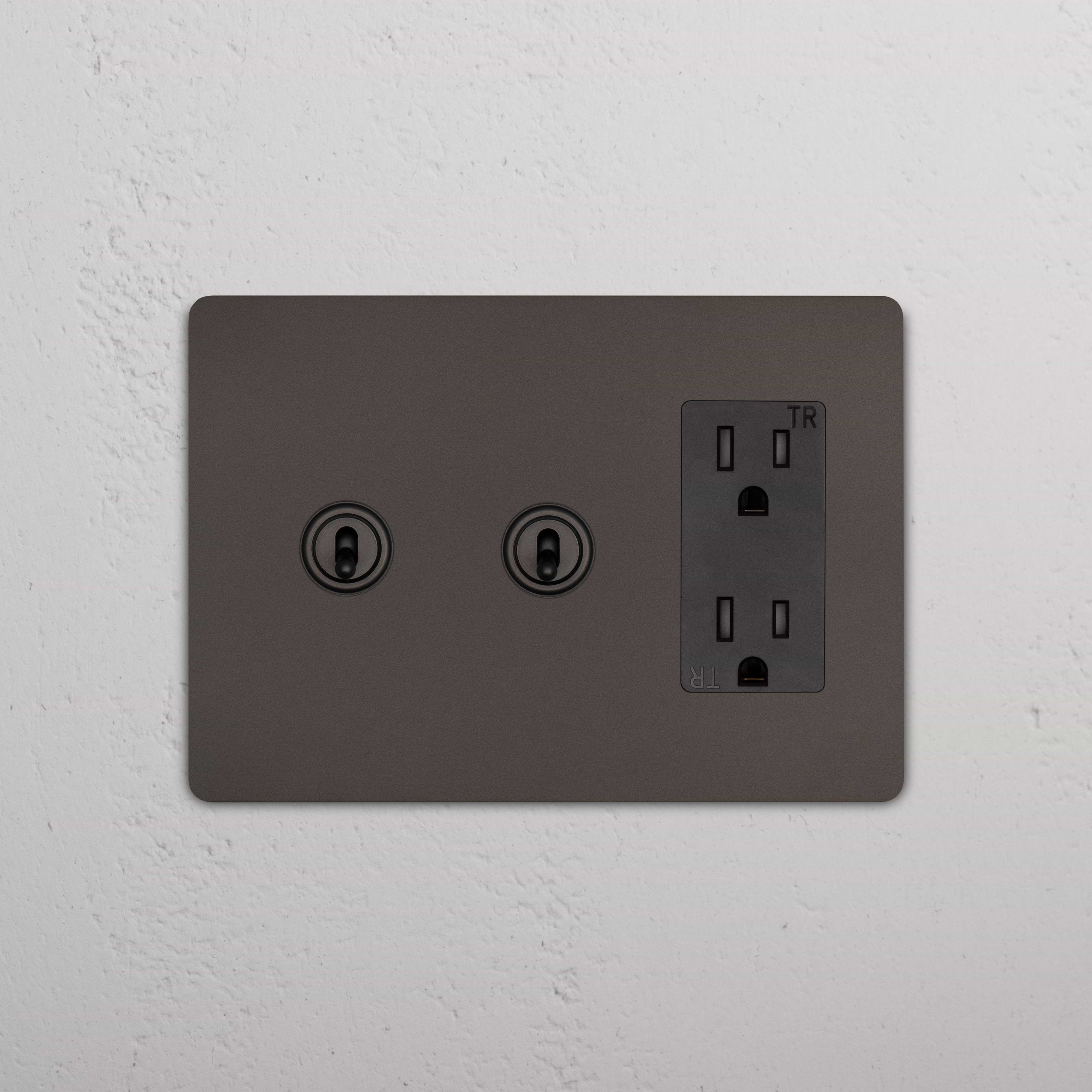 Grove 3G 2x Toggle Switch & Outlet in Bronze Black finish, with two toggles and a three-prong outlet.