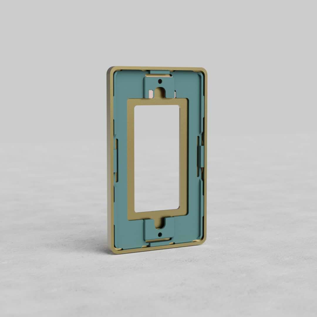 Rectangular antique brass 1-gang US outlet plate with central cutout, shown on a light gray surface.