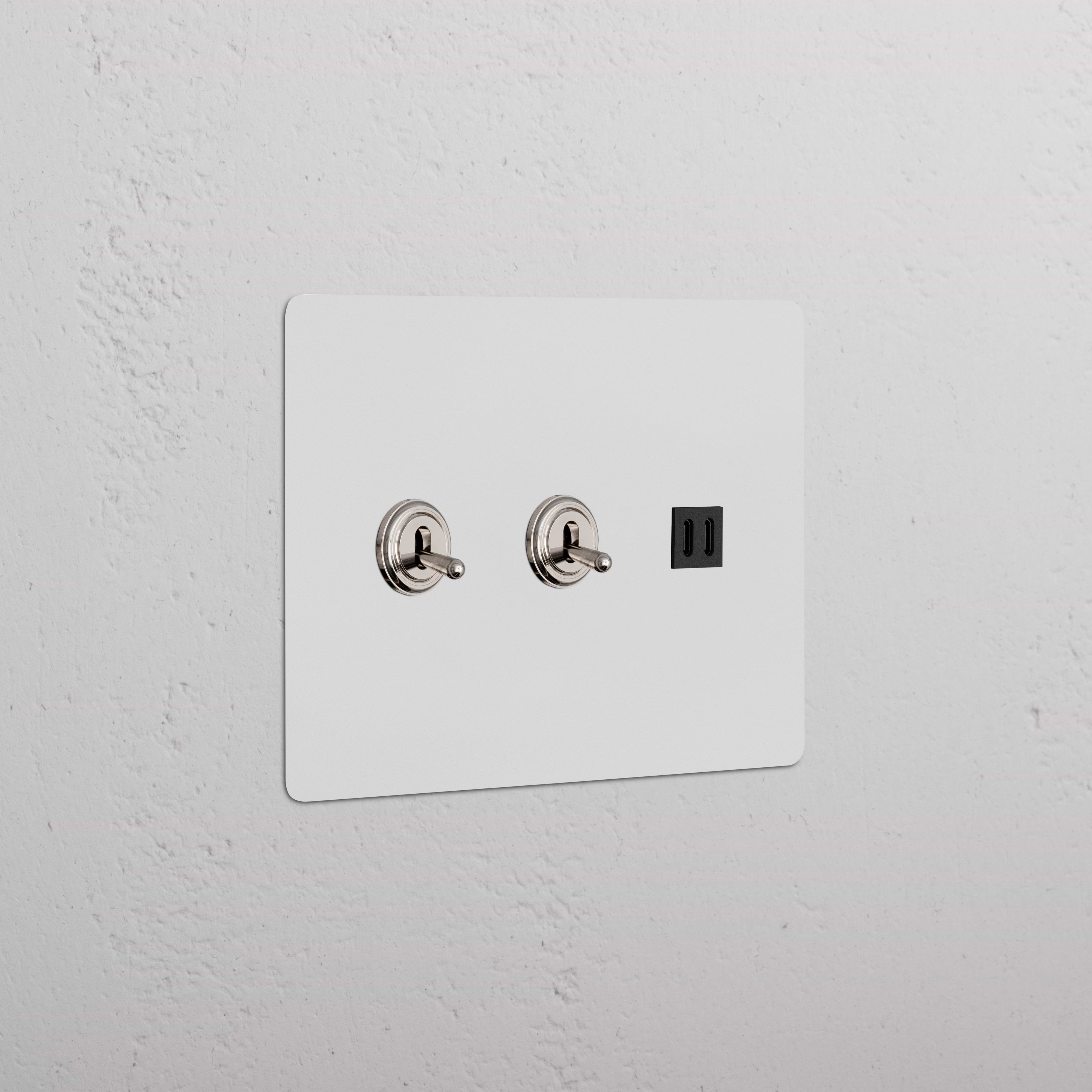 Kew 3G polished nickel black wall plate with two toggle switches and a fast charge USB port.