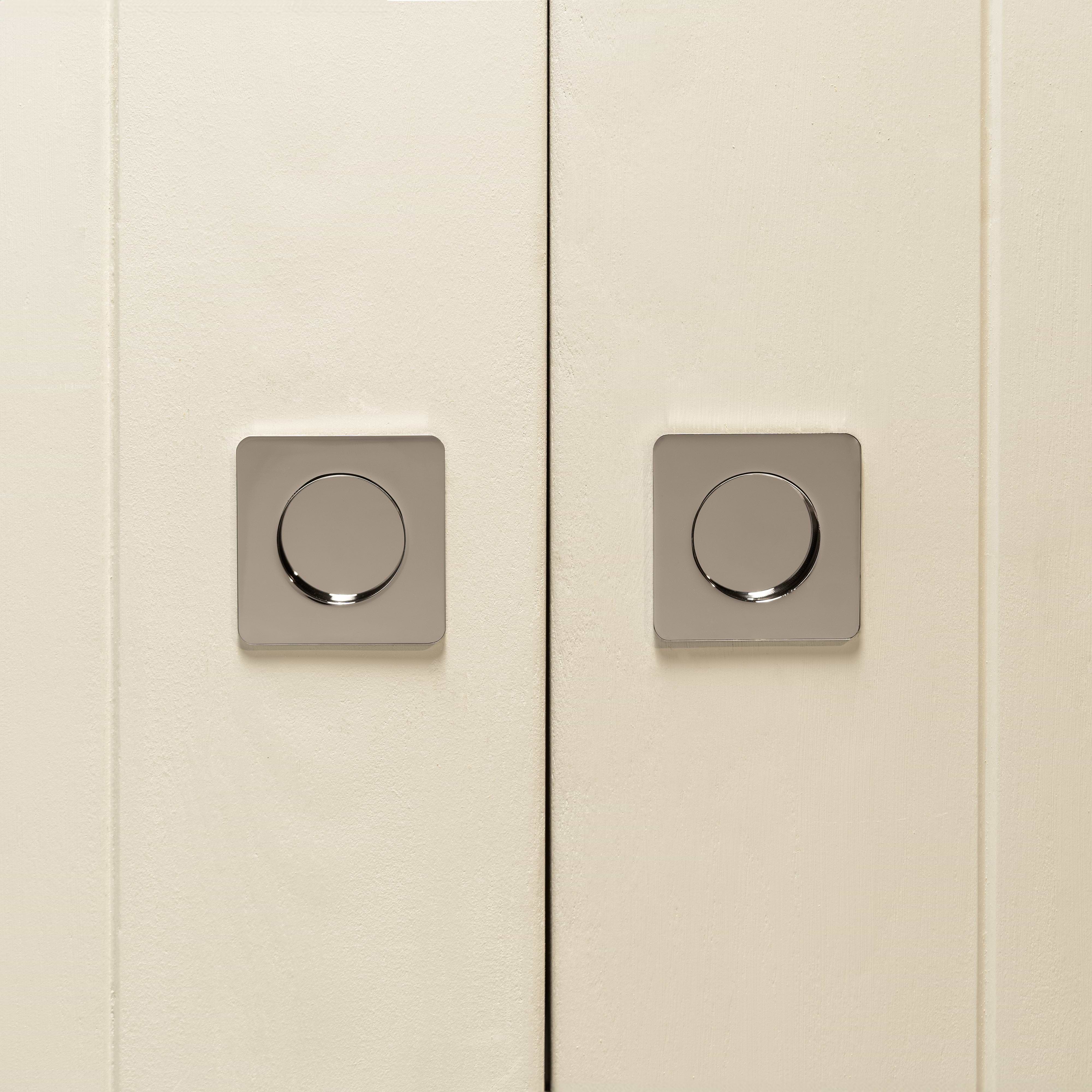 Pair of cabinet doors with Regent Recessed Small Pull handles in polished nickel, showing a sleek round design.