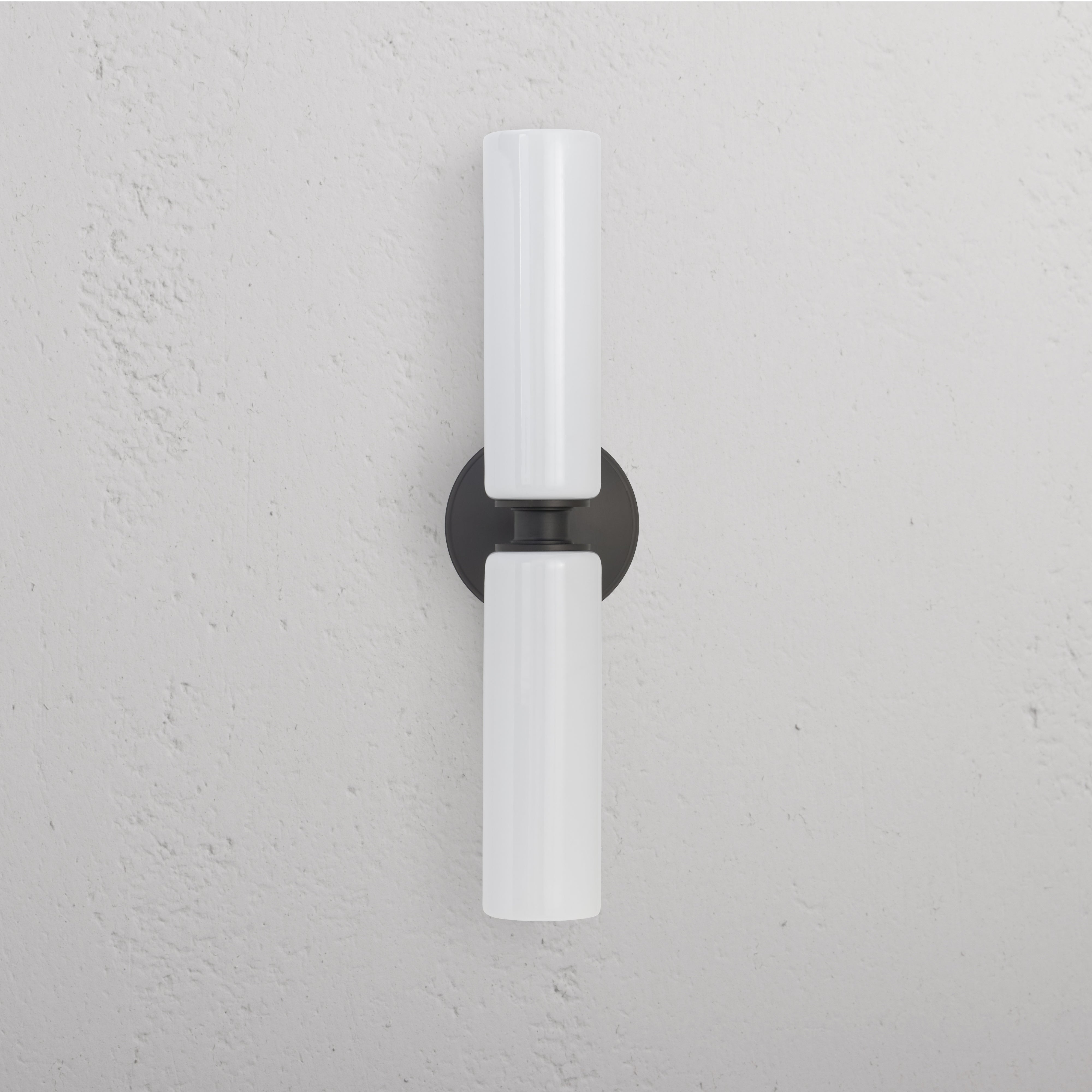 Claremont Medium Wall Light Fine Porcelain in bronze finish, featuring two vertical white porcelain shades.