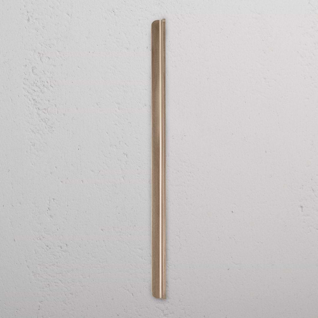 Oxford Furniture Handle Large in antique brass finish, showing its elegant, elongated design against a white background.