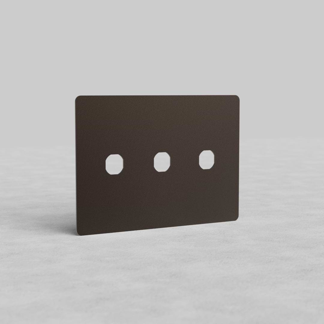 Bronze 3-gang switch plate (Kew US) with three rectangular switch openings, shown upright on a neutral background.