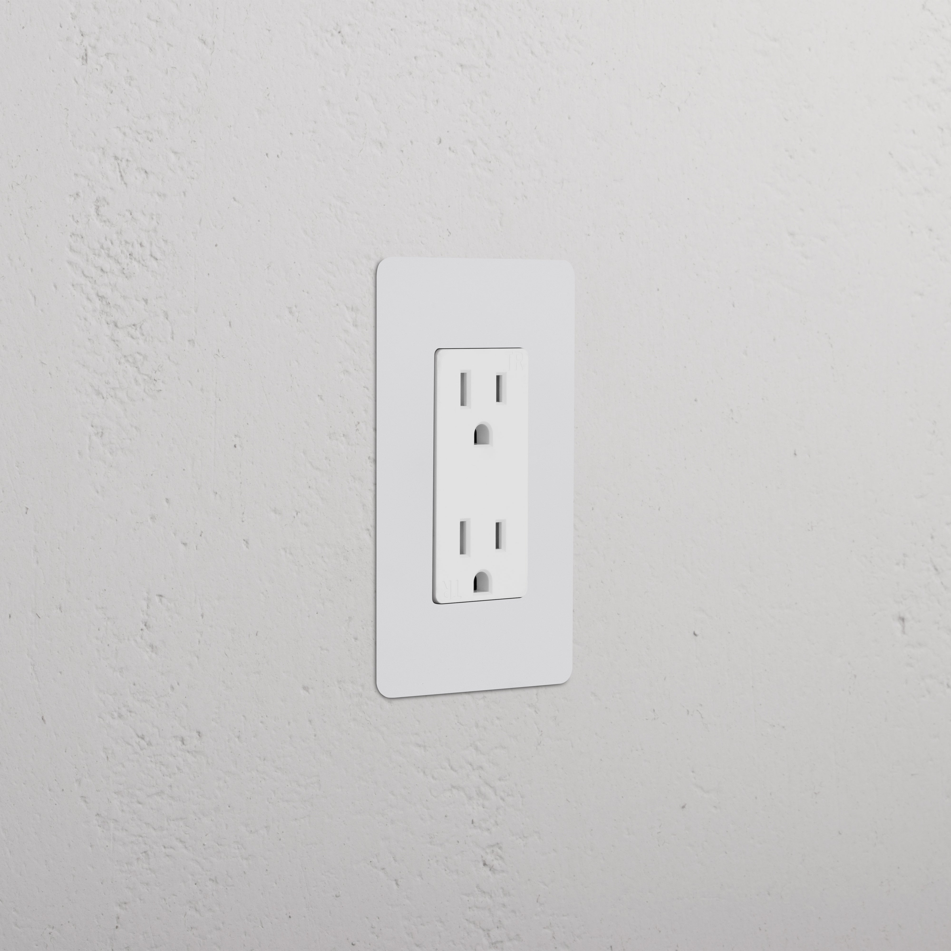 Kew 1G 15A Outlet in paintable white finish, single socket, shown installed on a white wall.